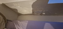 No headboard and flaky paint dust everywhere. Very must smell when trying to sleep