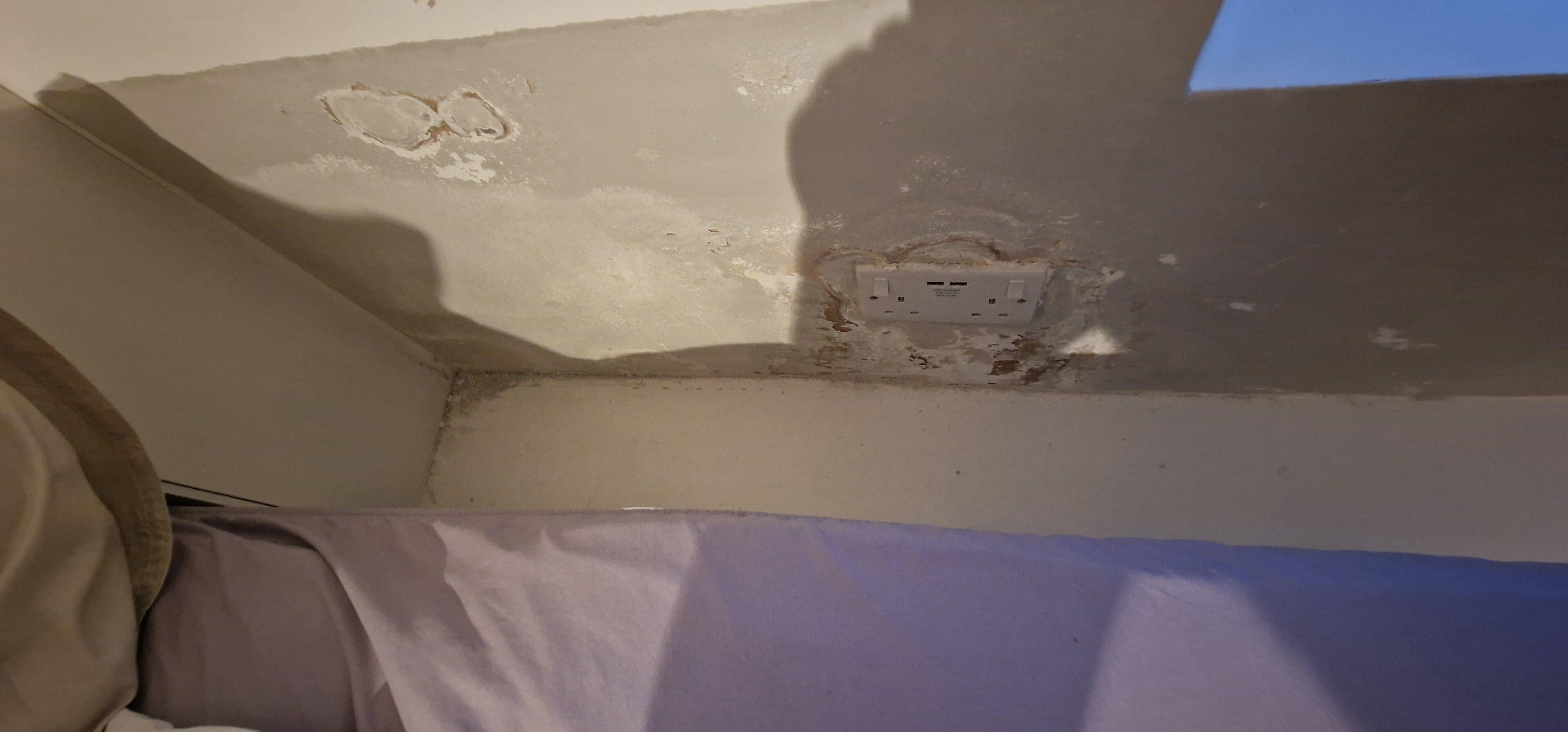 No headboard and flaky paint dust everywhere. Very must smell when trying to sleep 