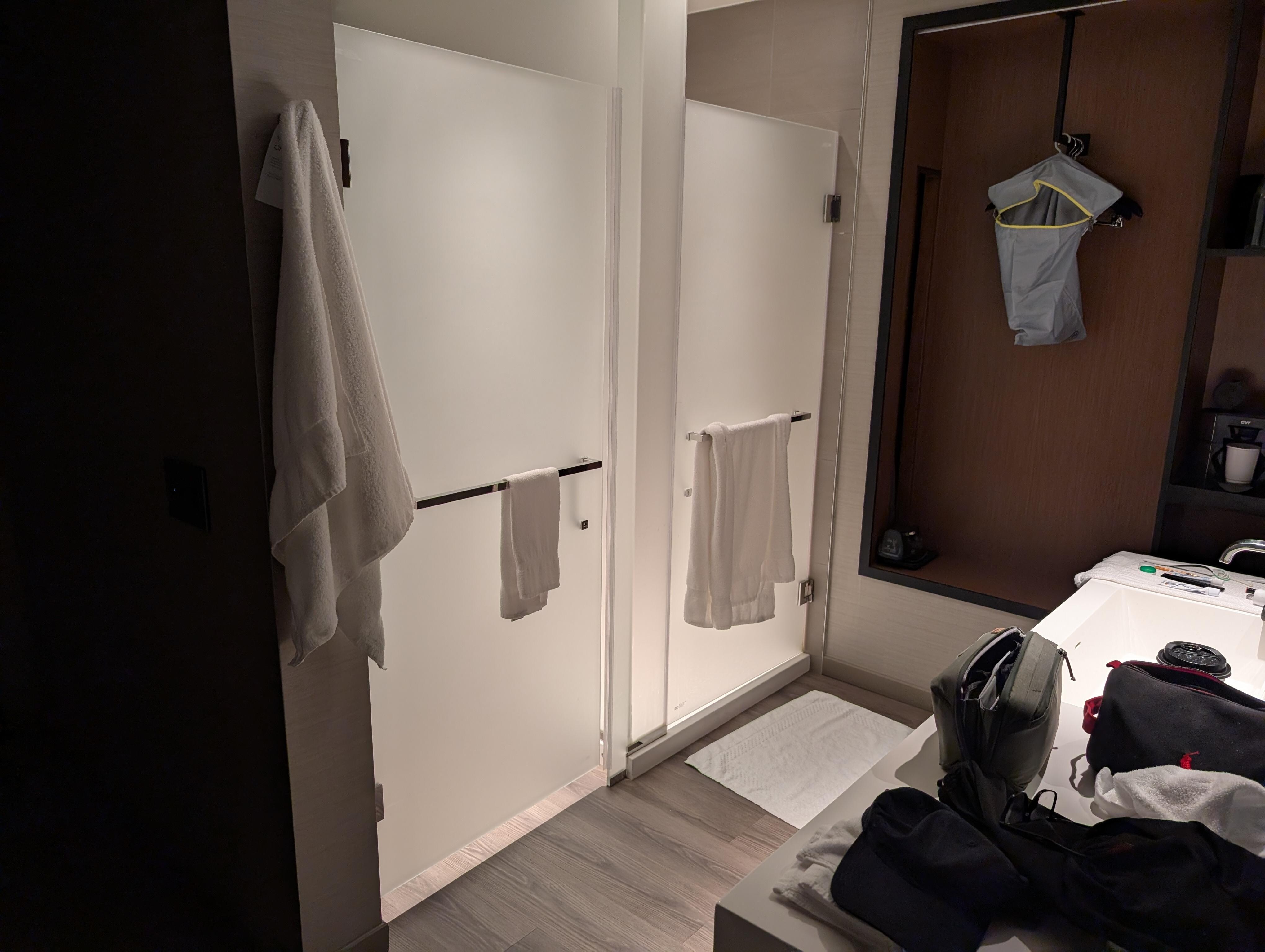 There's no bath "room". These stalls face the bed, partially blocked by sink n mirror. 