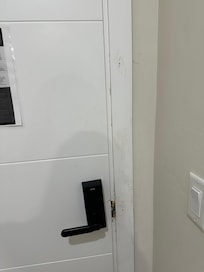 Entry door to the room that appears to have been kicked in at some point.