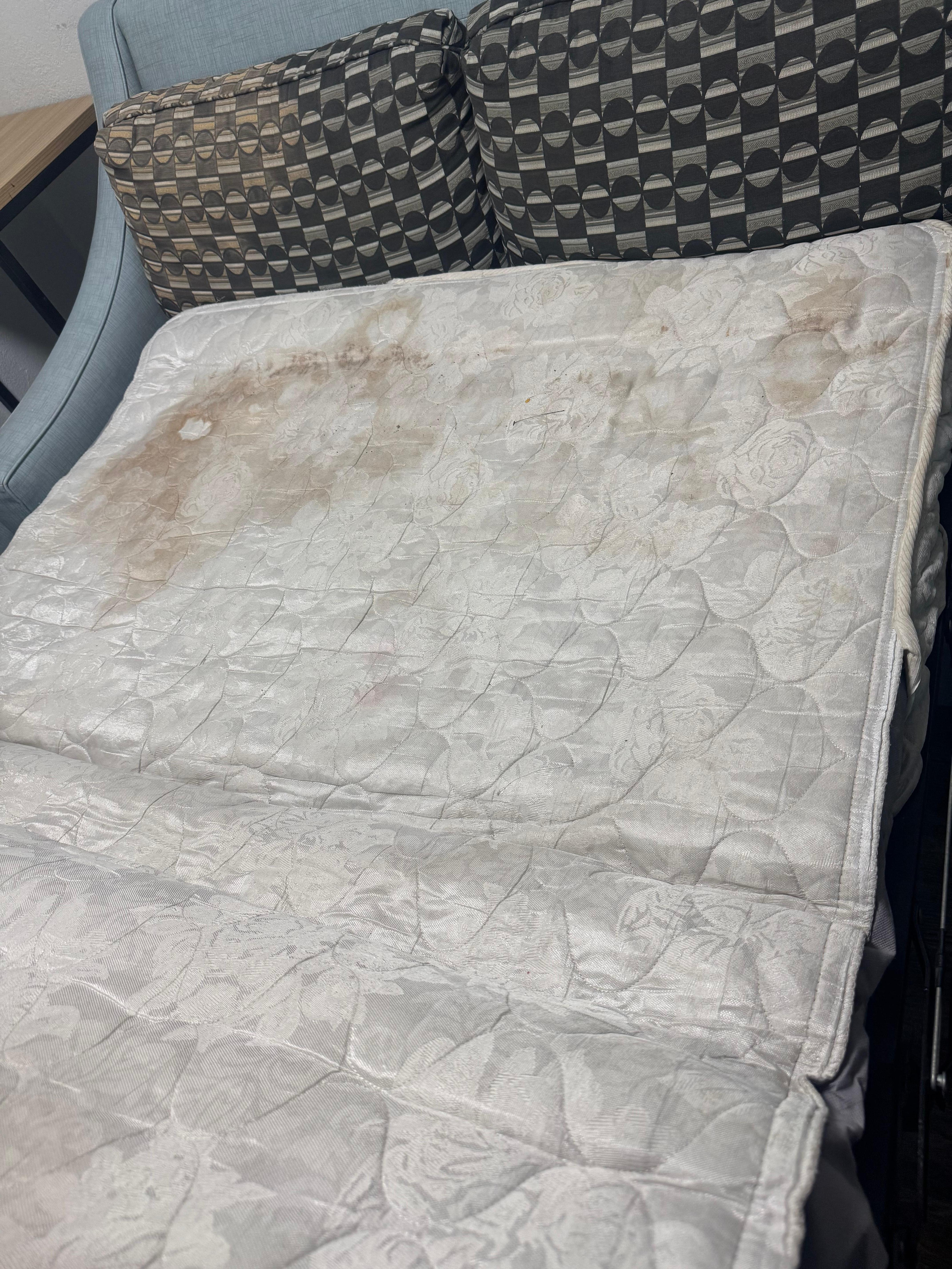The first sofa bed, dirty, no sheets