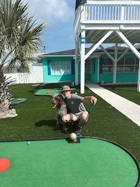 Tyler and Otis playing some afternoon putt putt