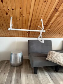 The ceiling on both sides of the room go very low.