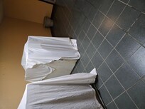 Ice machines rusted sides covered by sheets