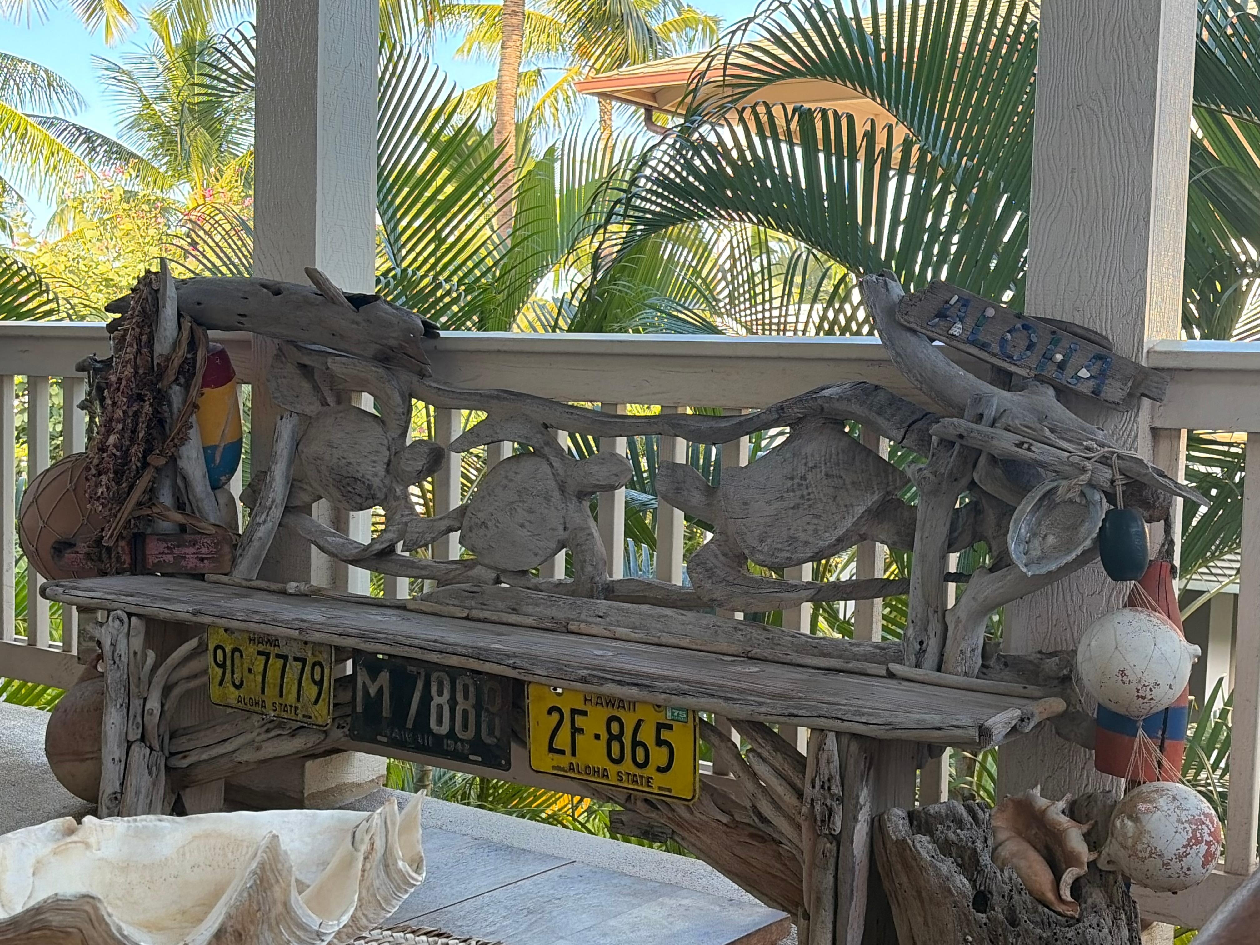 Hand carved bench on lanai. 