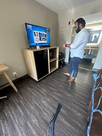 Manager fixing TV although not requested or needed by guest. He did help me set up room WiFi while he was there.