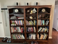 Fully stocked bookshelves as you come in the front door.
