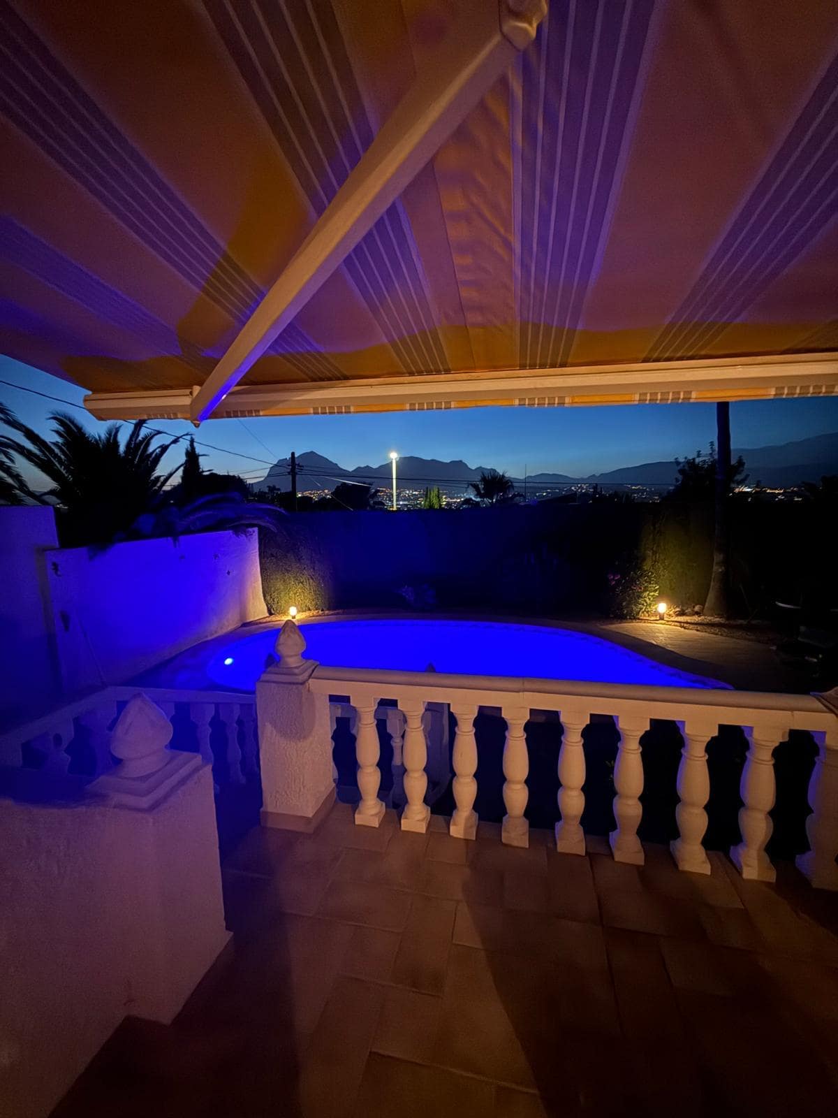 The night time pool view from the terrace