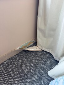 Where the baseboard was coming off.