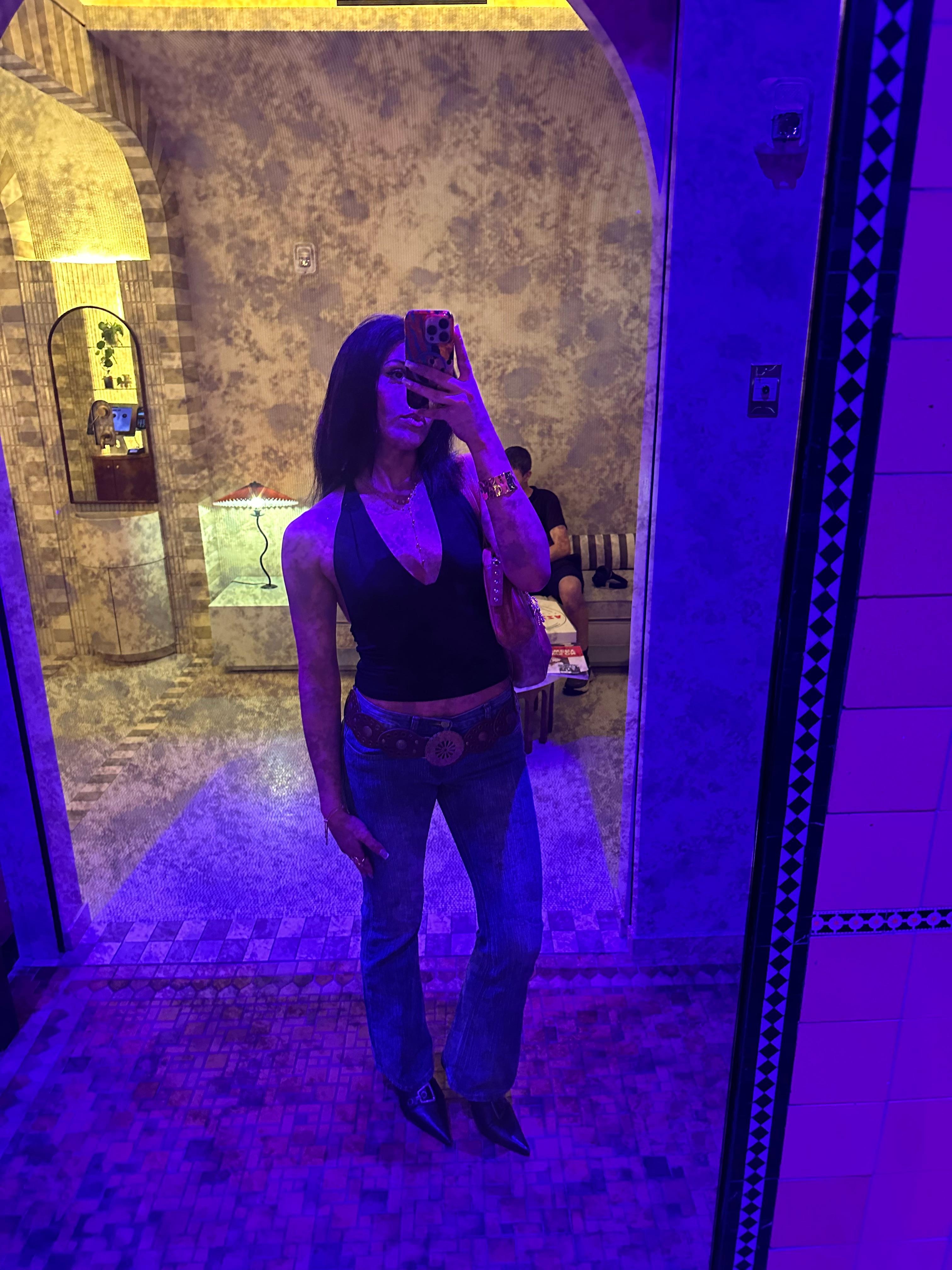 Lobby area mirror by front door at night