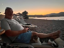 Sun loungers are available, complete with friendly neighborhood cat!