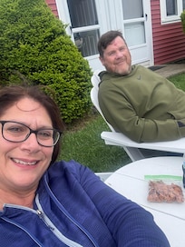 Comfy on Adirondack chairs out front of our building