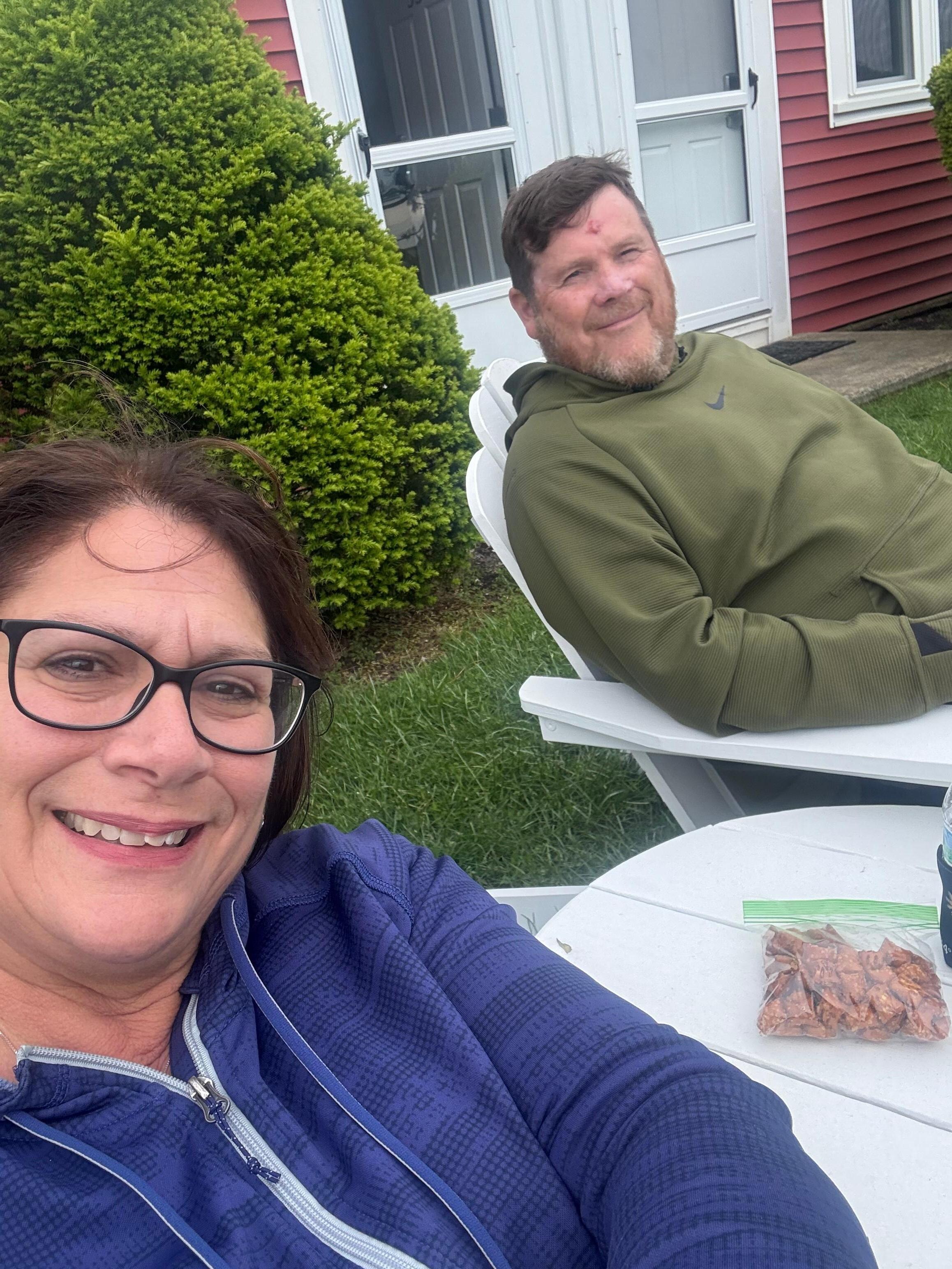 Comfy on Adirondack chairs out front of our building