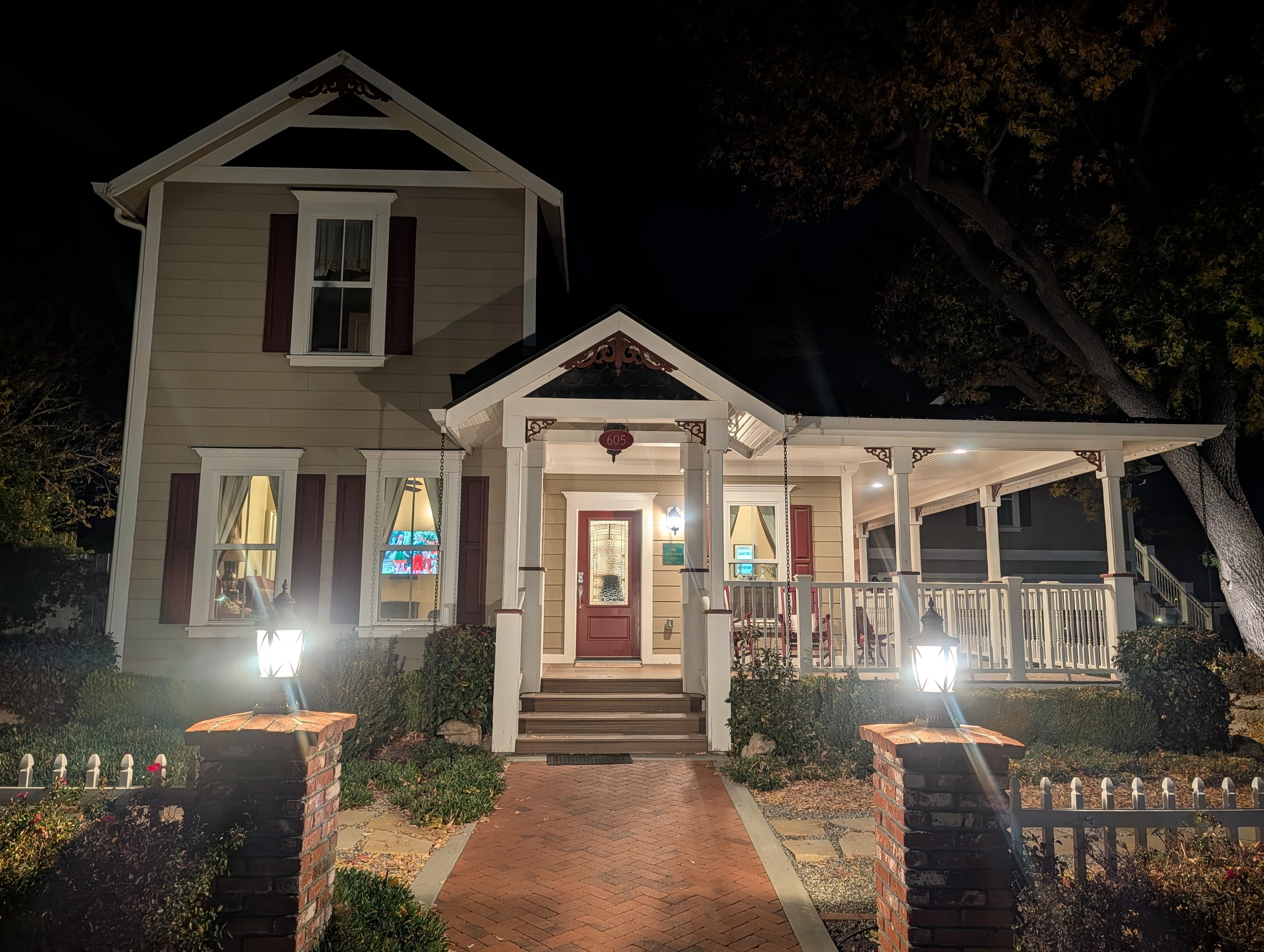 The home at night from outside.