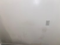 Dirt marks and patches on the wall