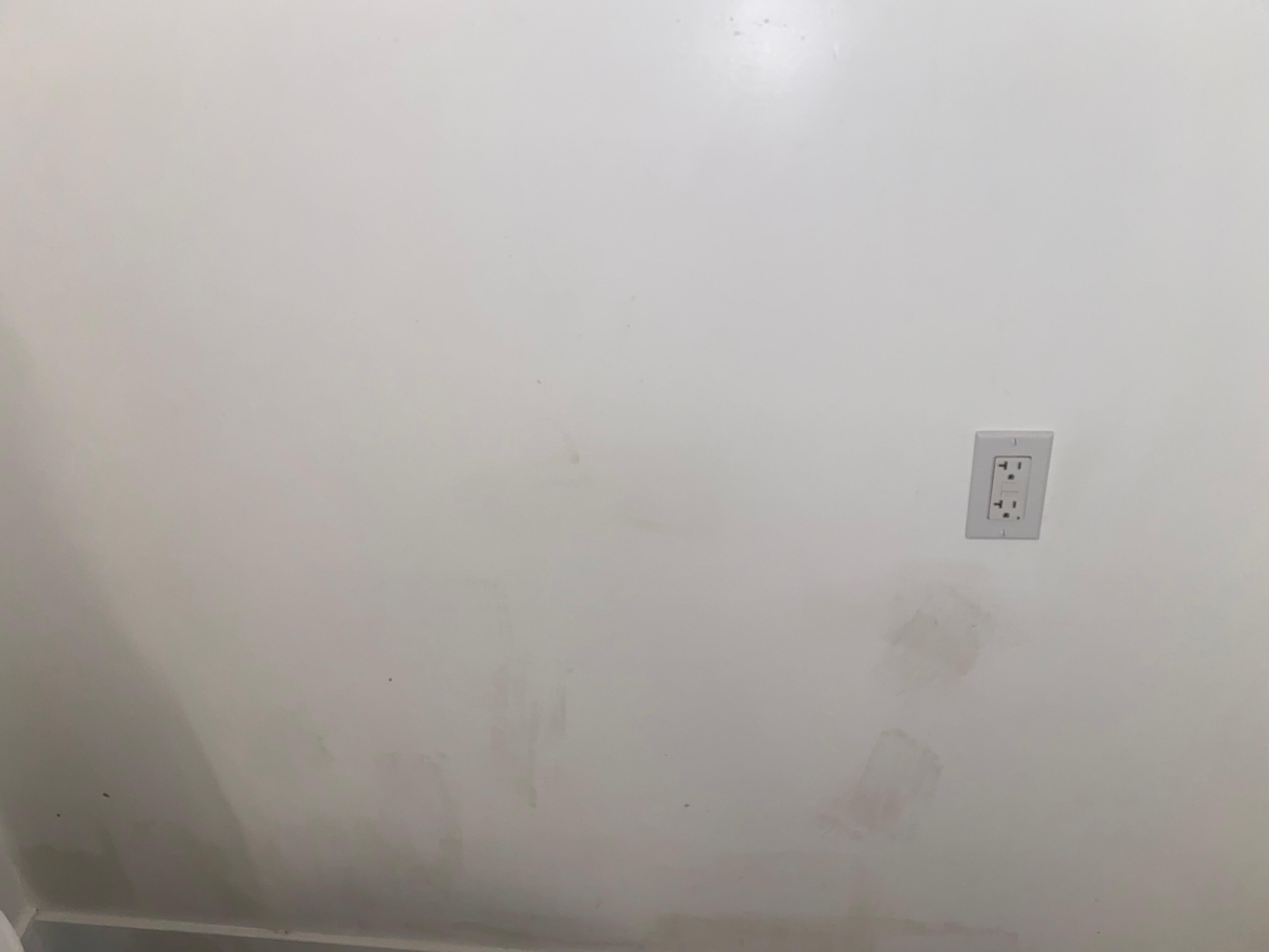 Dirt marks and patches on the wall