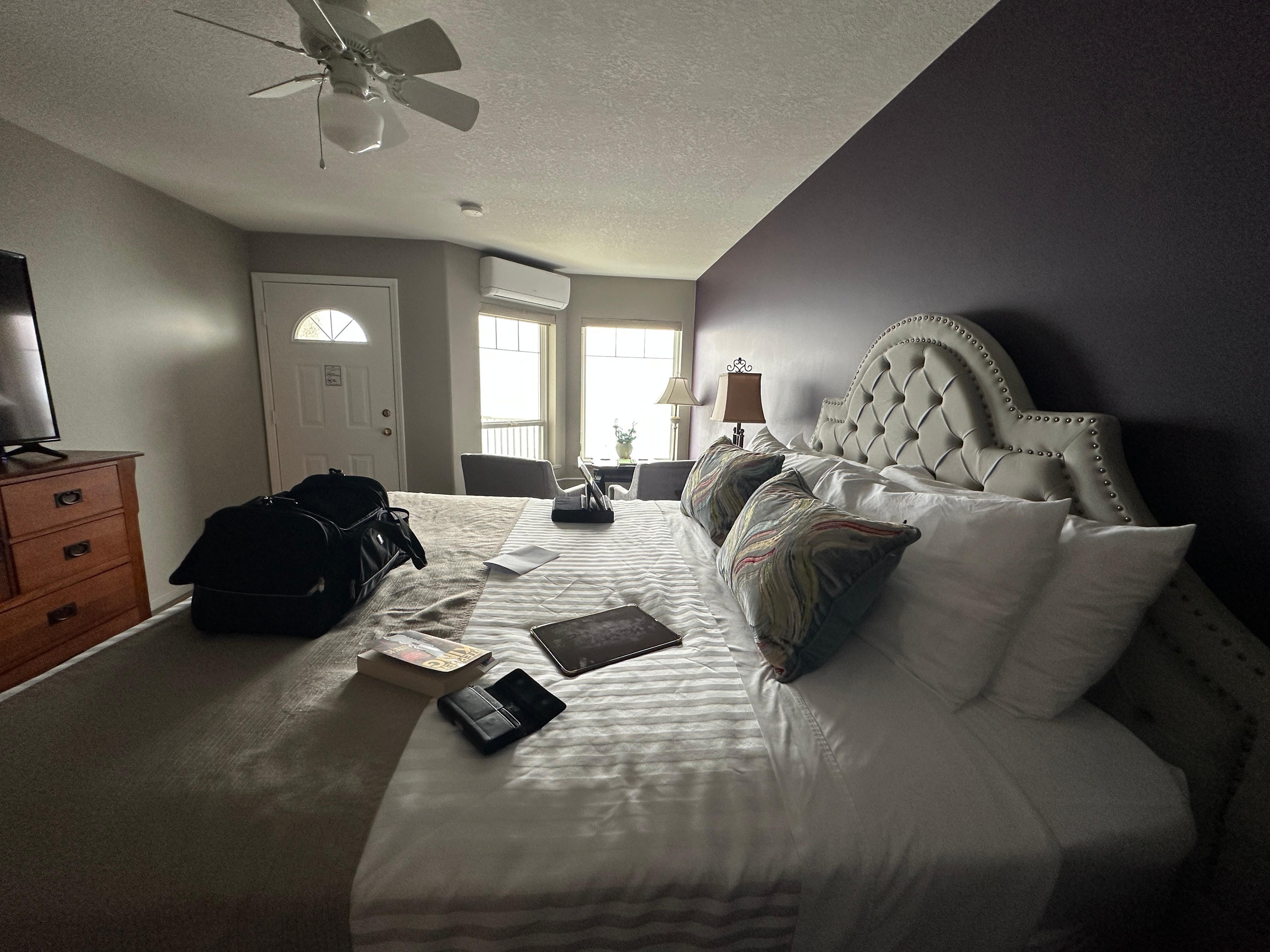 From the doorway, across the king sized bed to the balcony and view windows.  