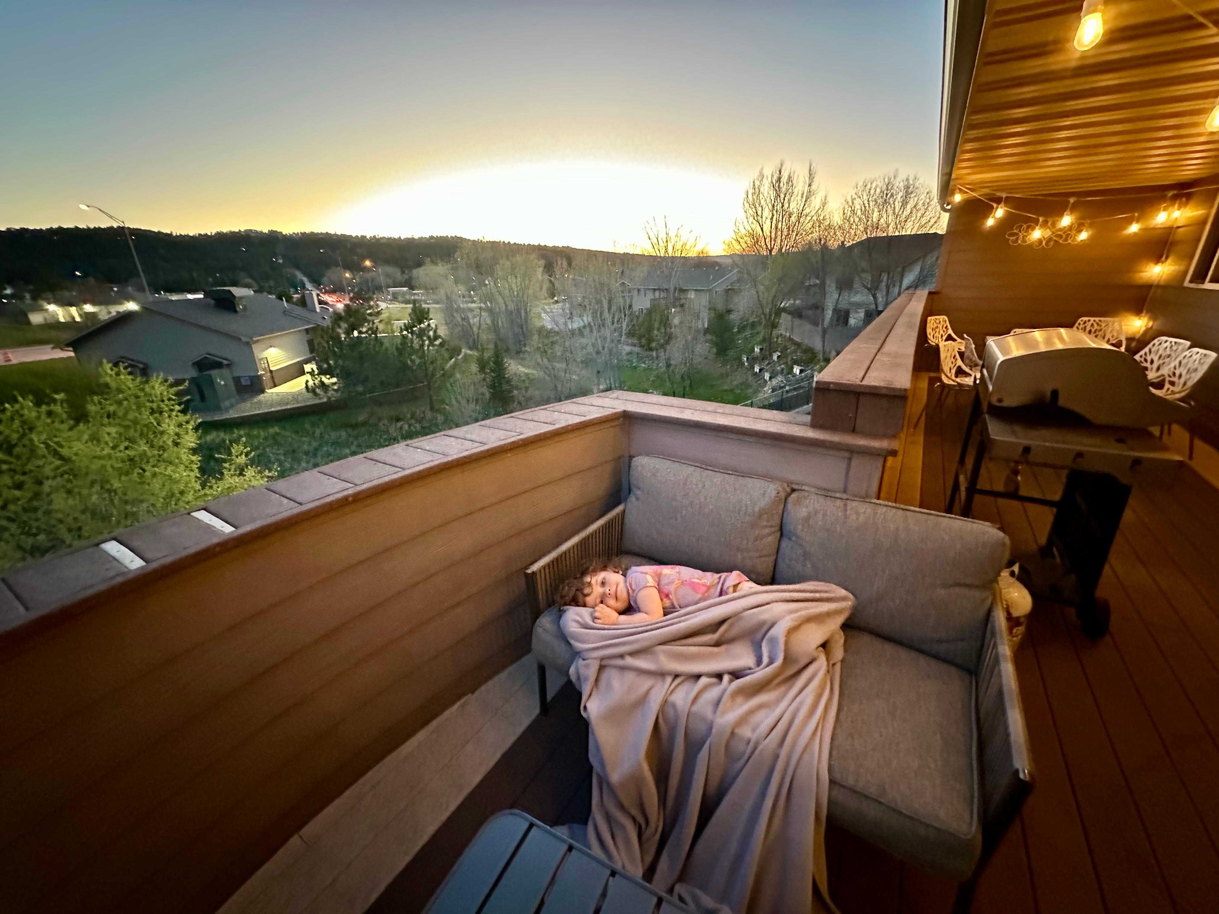 Our daughter enjoying a beautiful sunset on the deck! 
