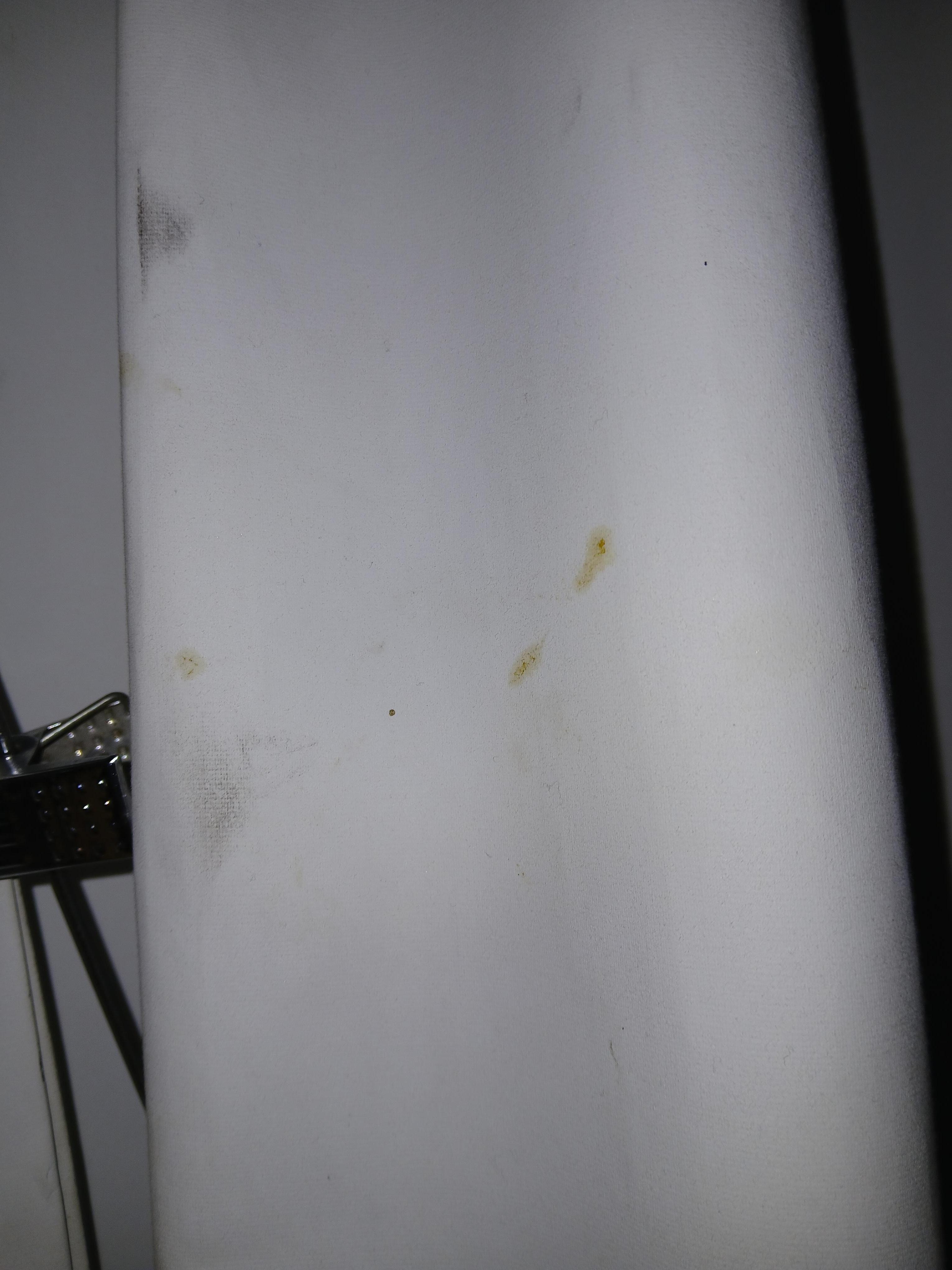 Black grease prints on the curtains 