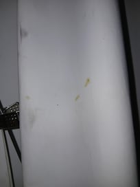 Black grease prints on the curtains