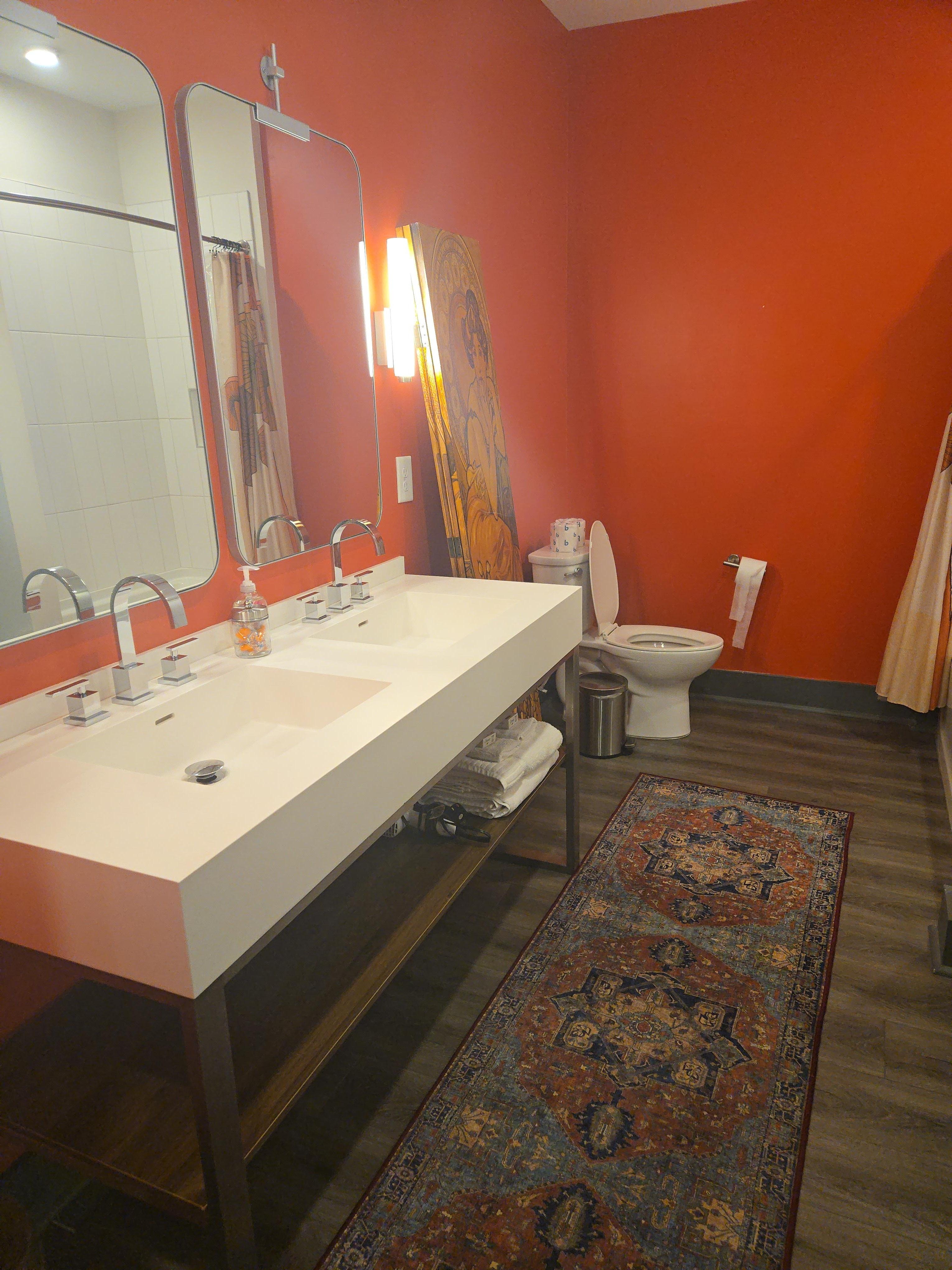 Spacious bathroom with plenty of fresh towels. 