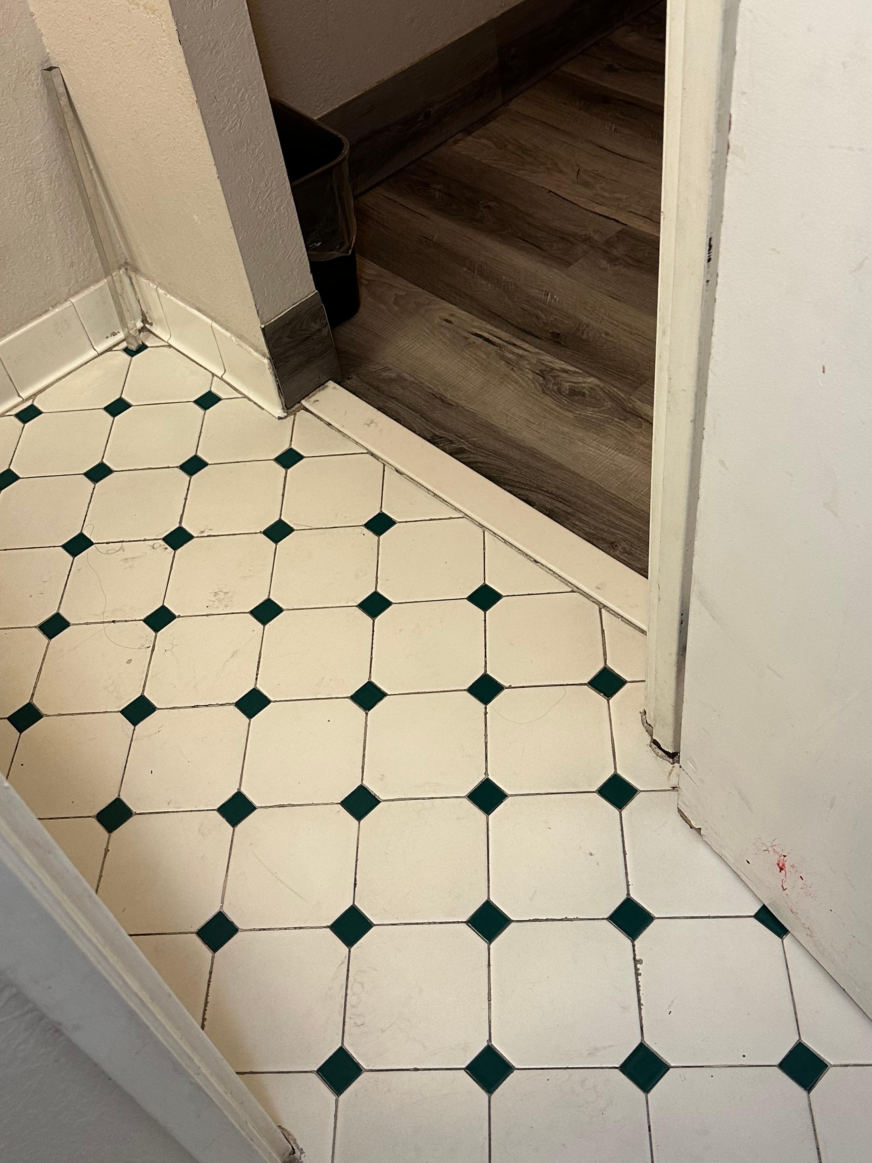 That is BLOOD oj the door of the bottom right corner of the photo.