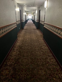 Creepy, outdated hallway that smells of old cigarette smoke
