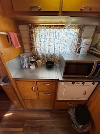 Inside vintage camper, kitchenette.