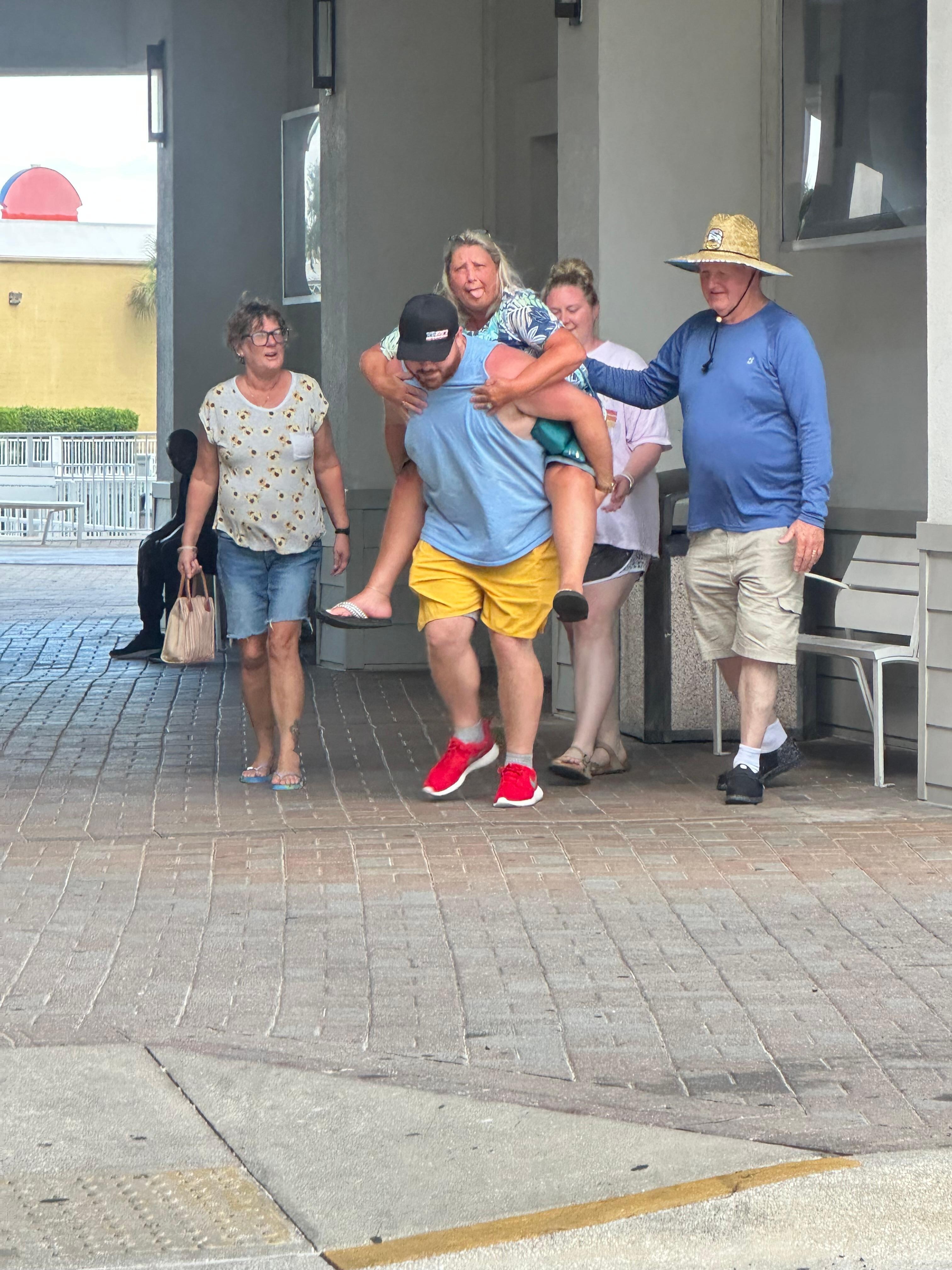 First grandson giving grandma a piggy back ride. 