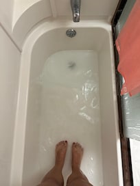 Clogged shower drain full of hair from previous renters