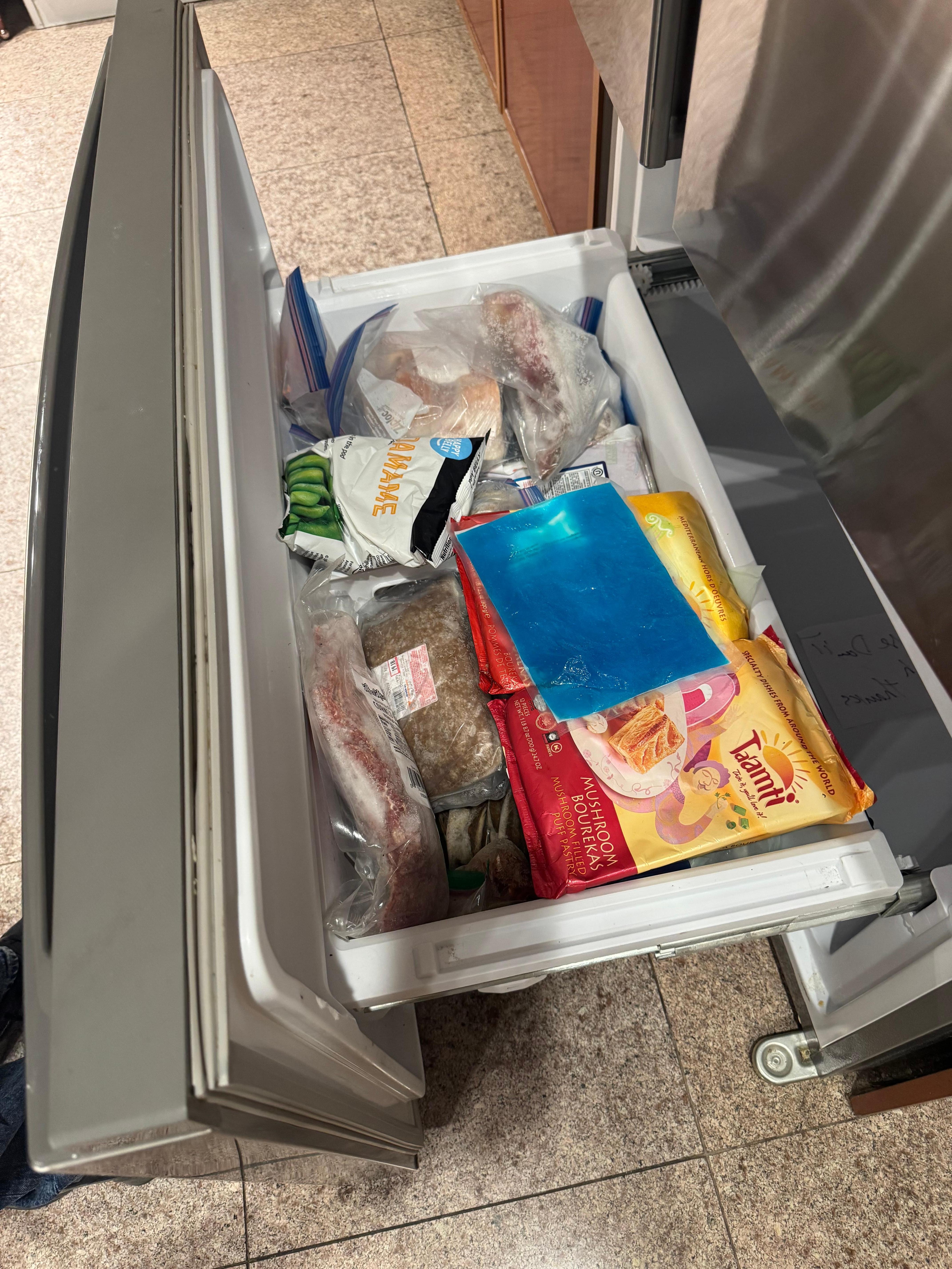 Packed freezer with over a year old expired meat