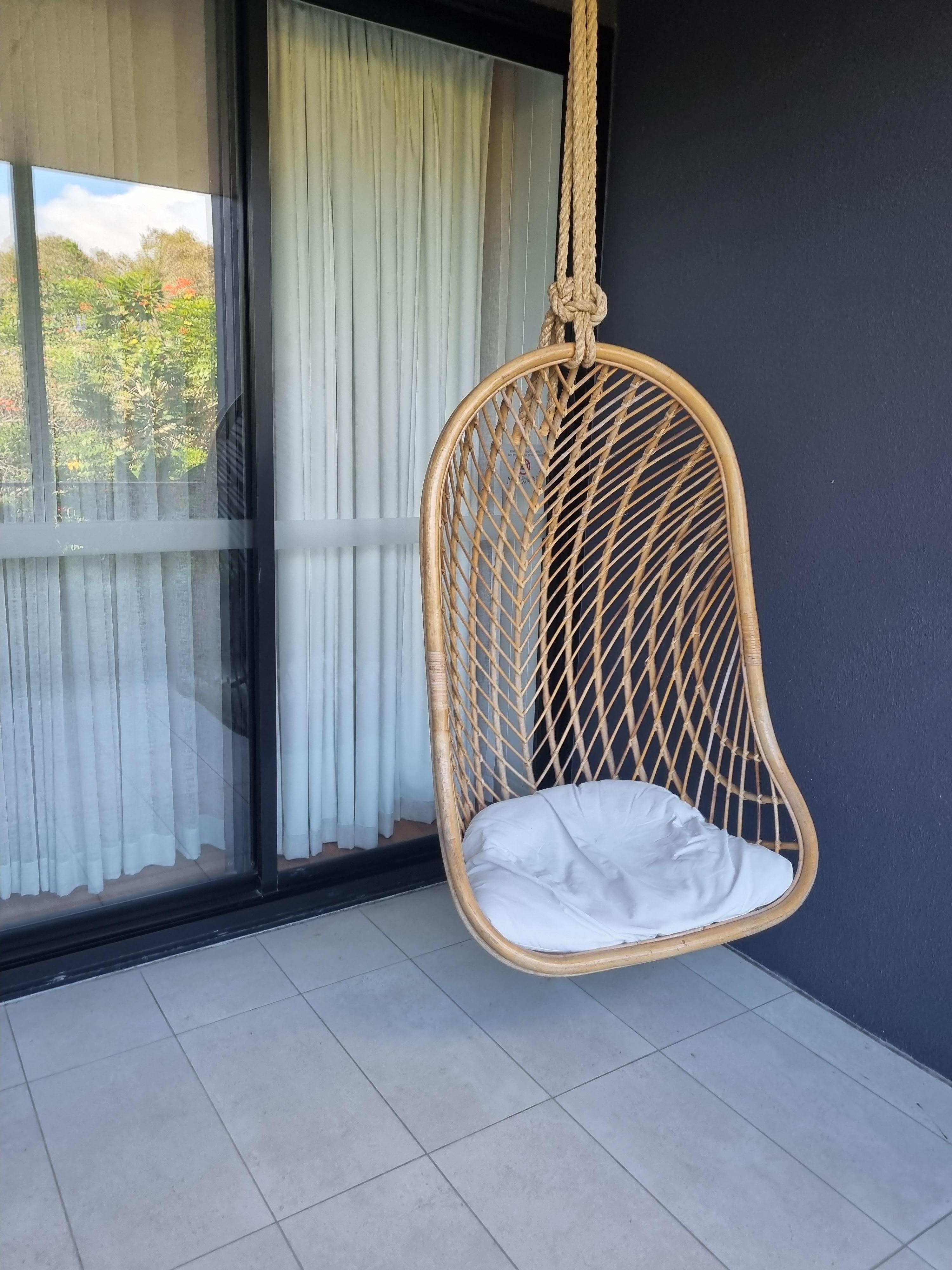 A swinging 'egg' chair to relax on, while reading a book, too! 🙂