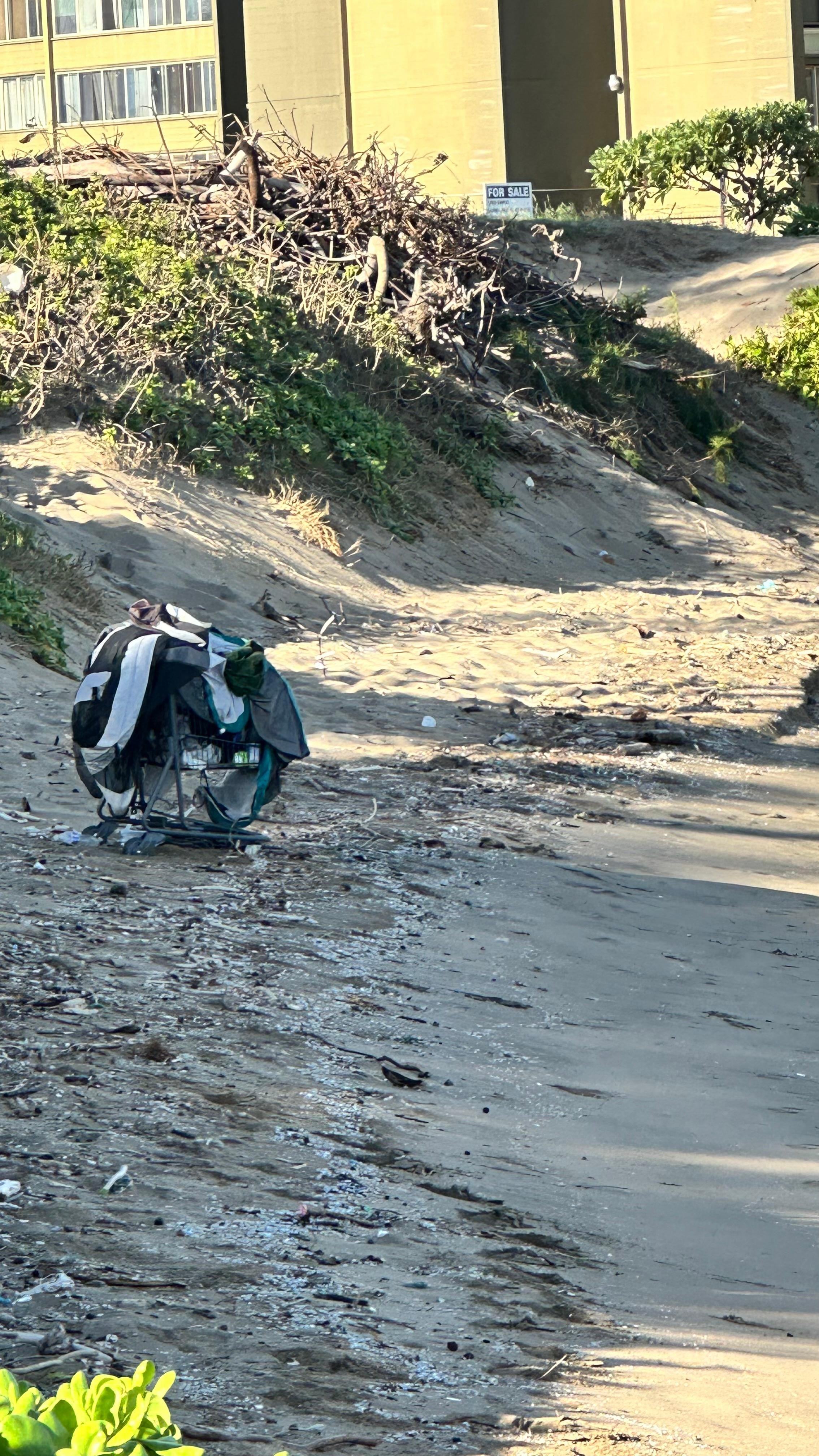 Homeless persons cart at the beach. 