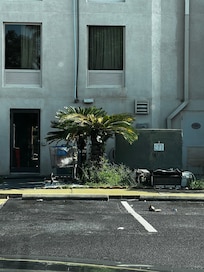 Garbage and grocery carts behind the building and by the pool