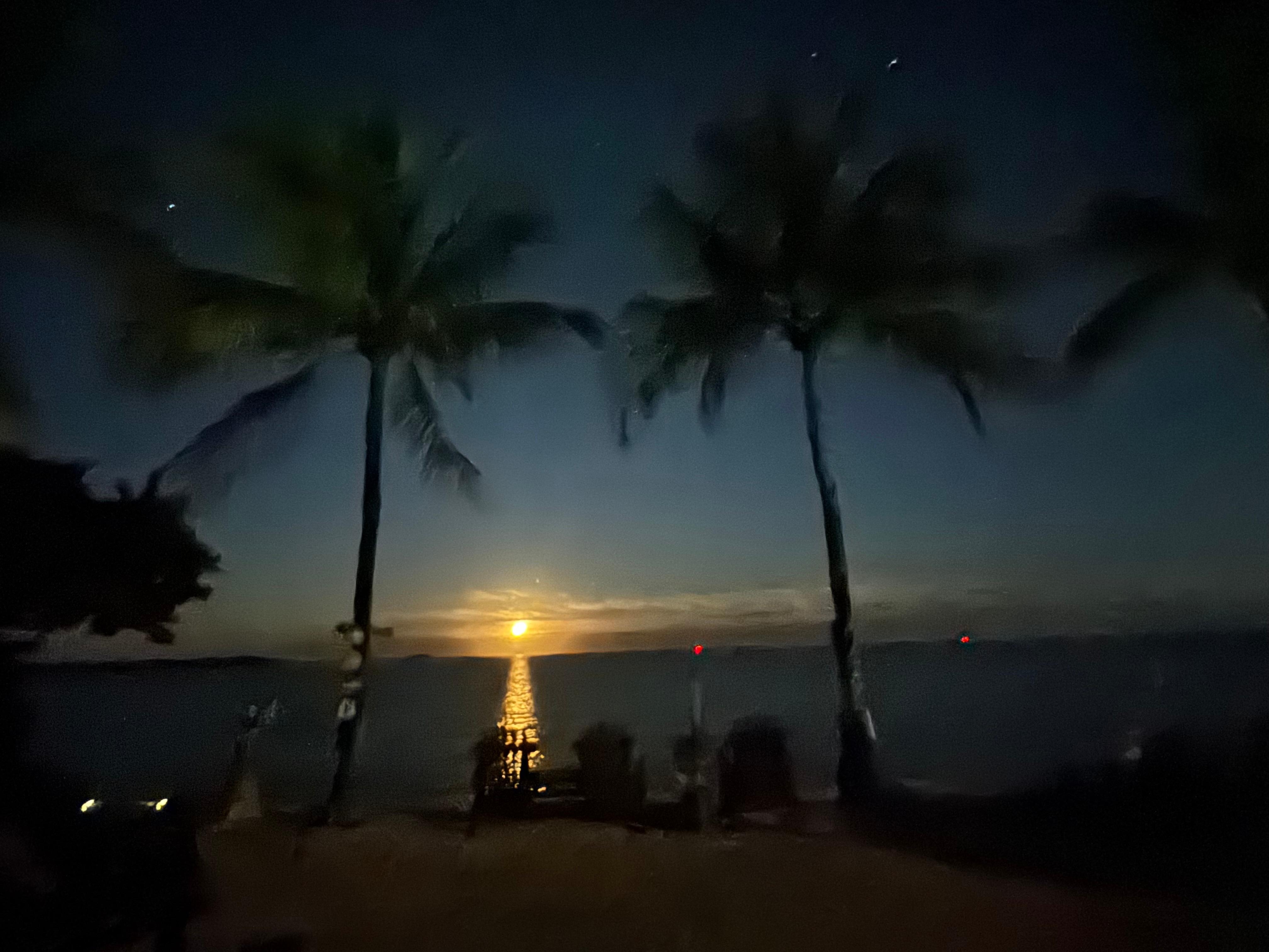 Moon setting over the water