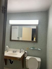 Mirror and light no level and the wall covering doesn’t cover all the way to the mirror