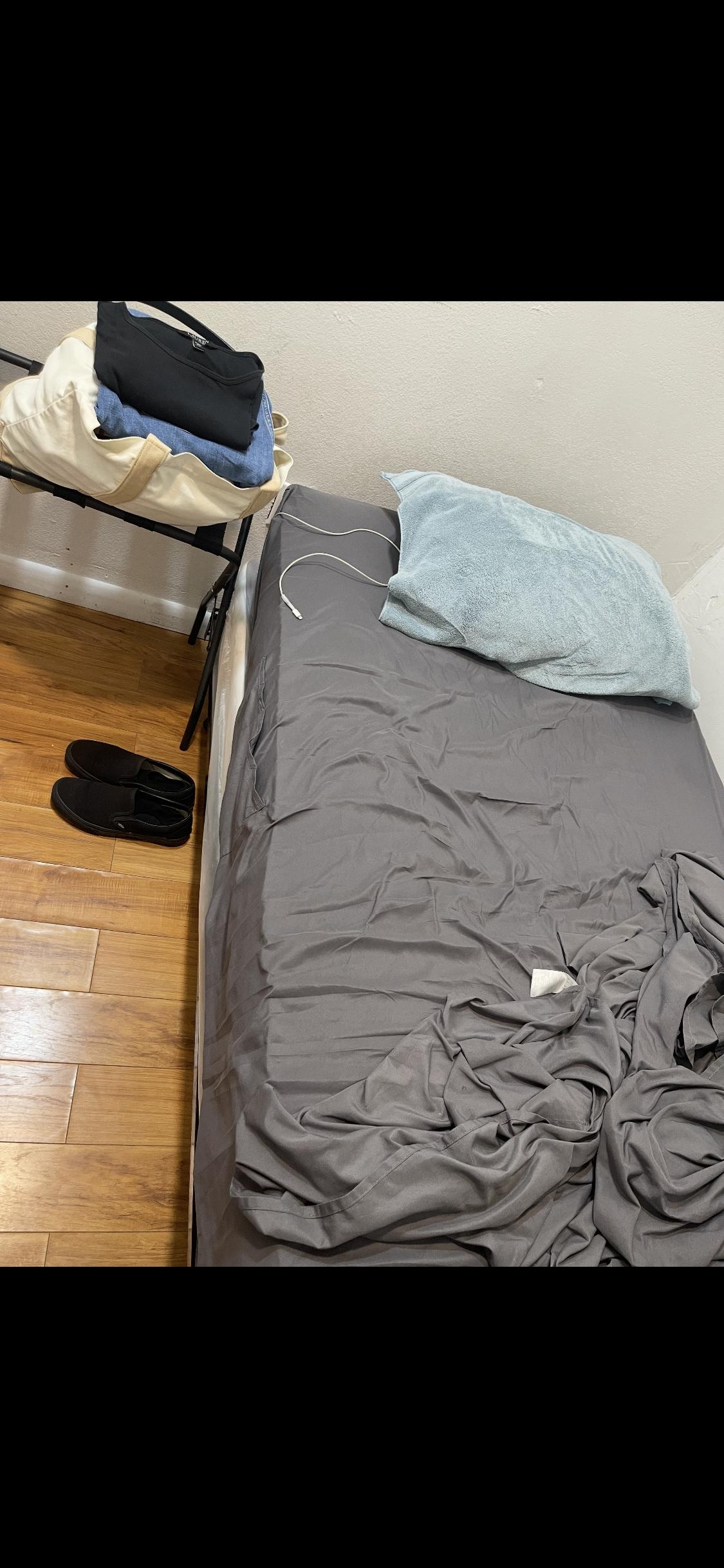 Basic Single Bed - When you enter the room, there's the bed infront of you and a small space of  walkway. No amenities or tv or anything like that. Just a door and a bed. Shower and bathroom are outside and no hot water in the shower. 