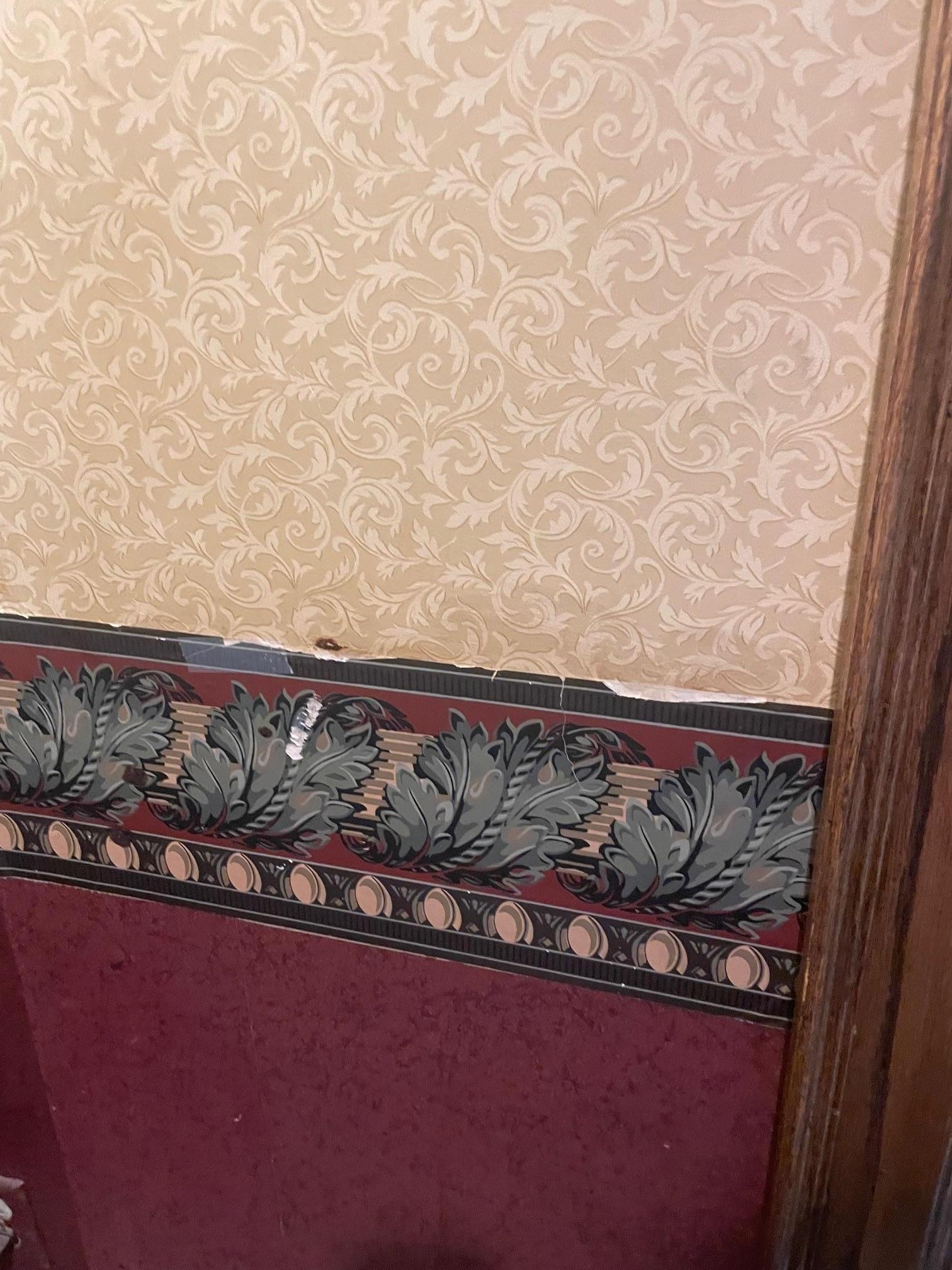 Filthy walls with peeling paper