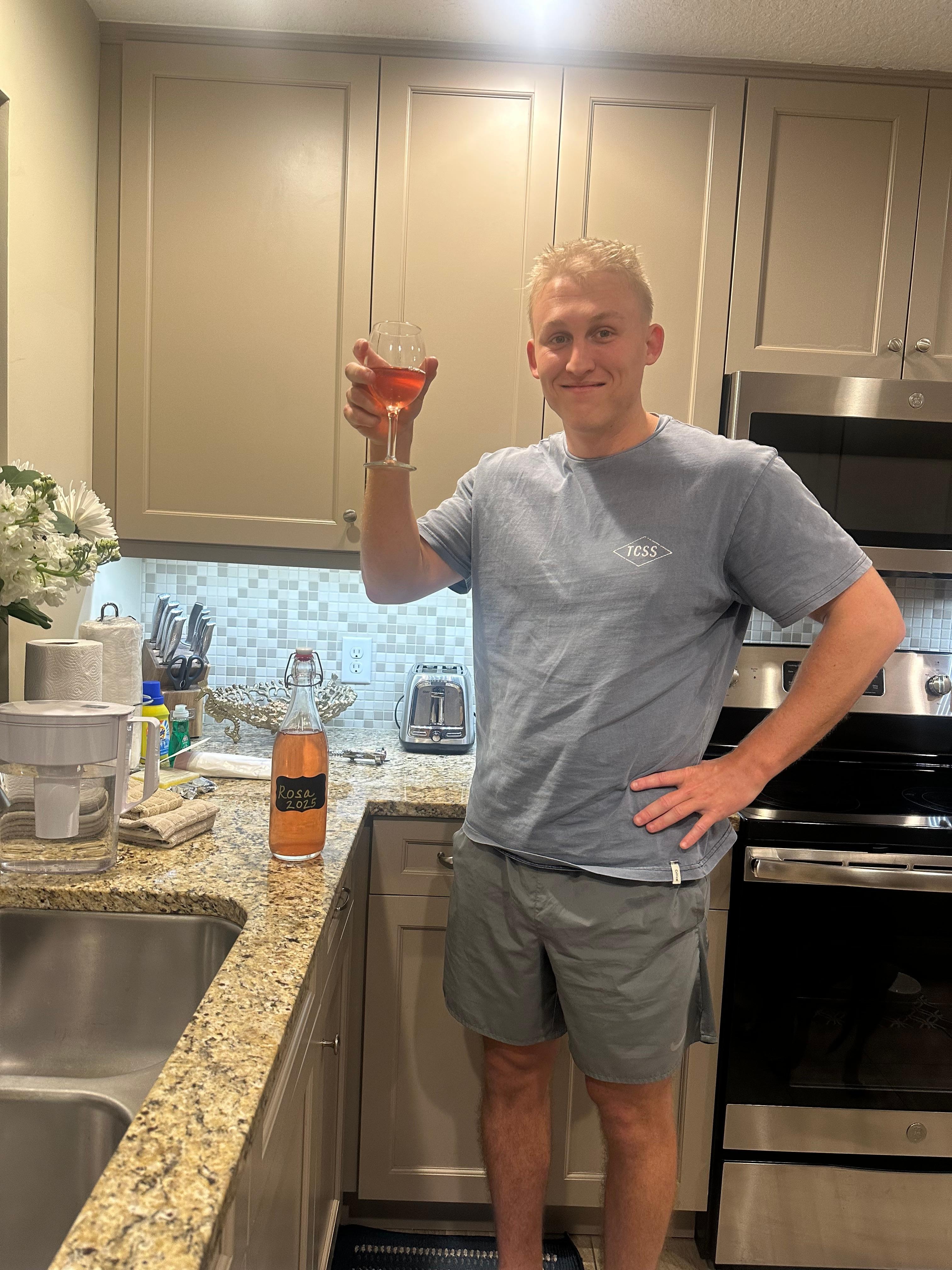 The groom enjoying some of mom‘s homemade wine at the condo. Mom and son time.🩷
