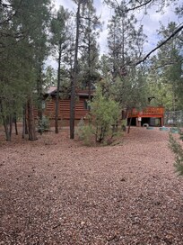 Back of the cabin. Secure chain link fence is 6’ tall.