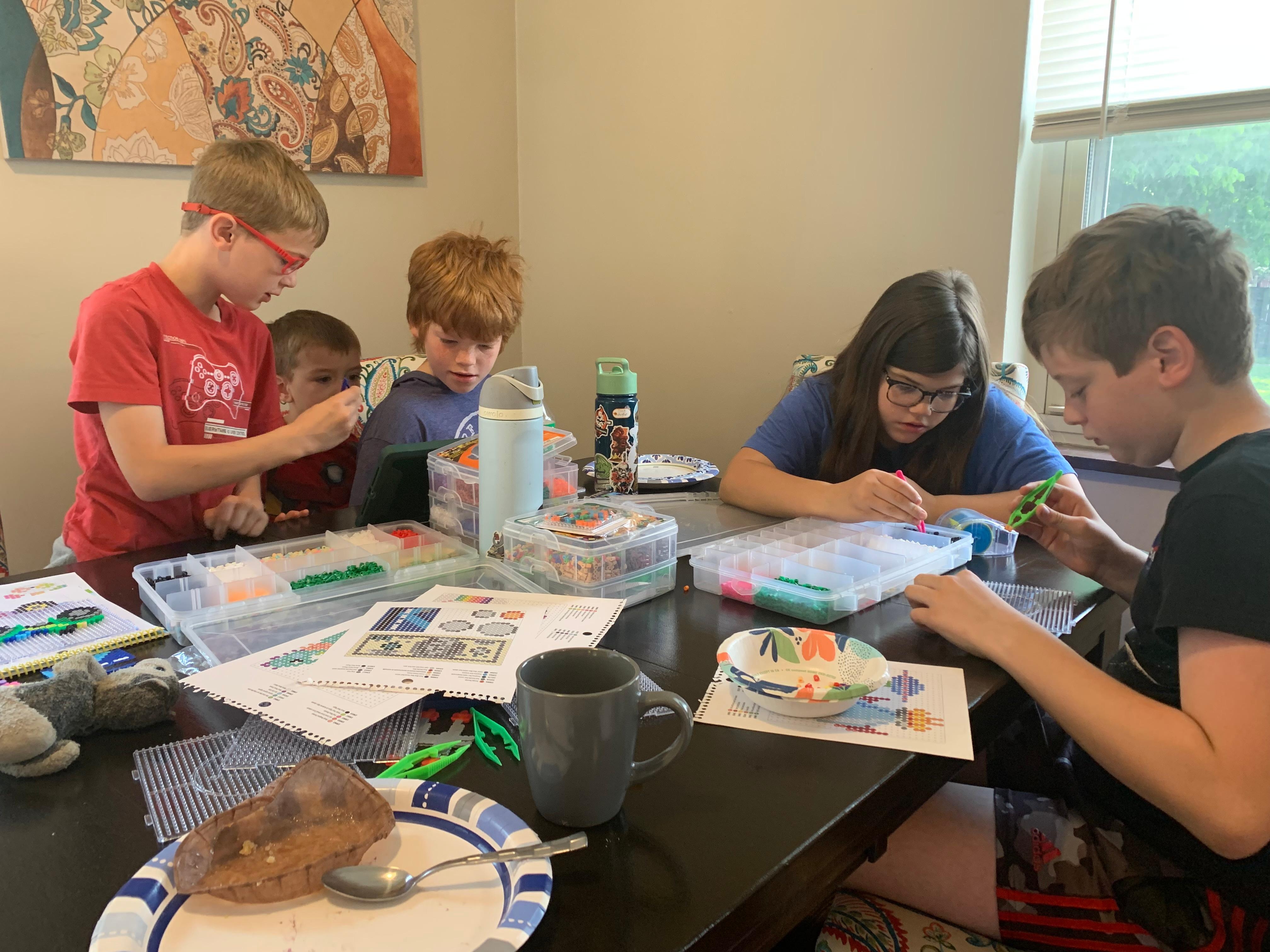 Grandkids working on Perler beads.  