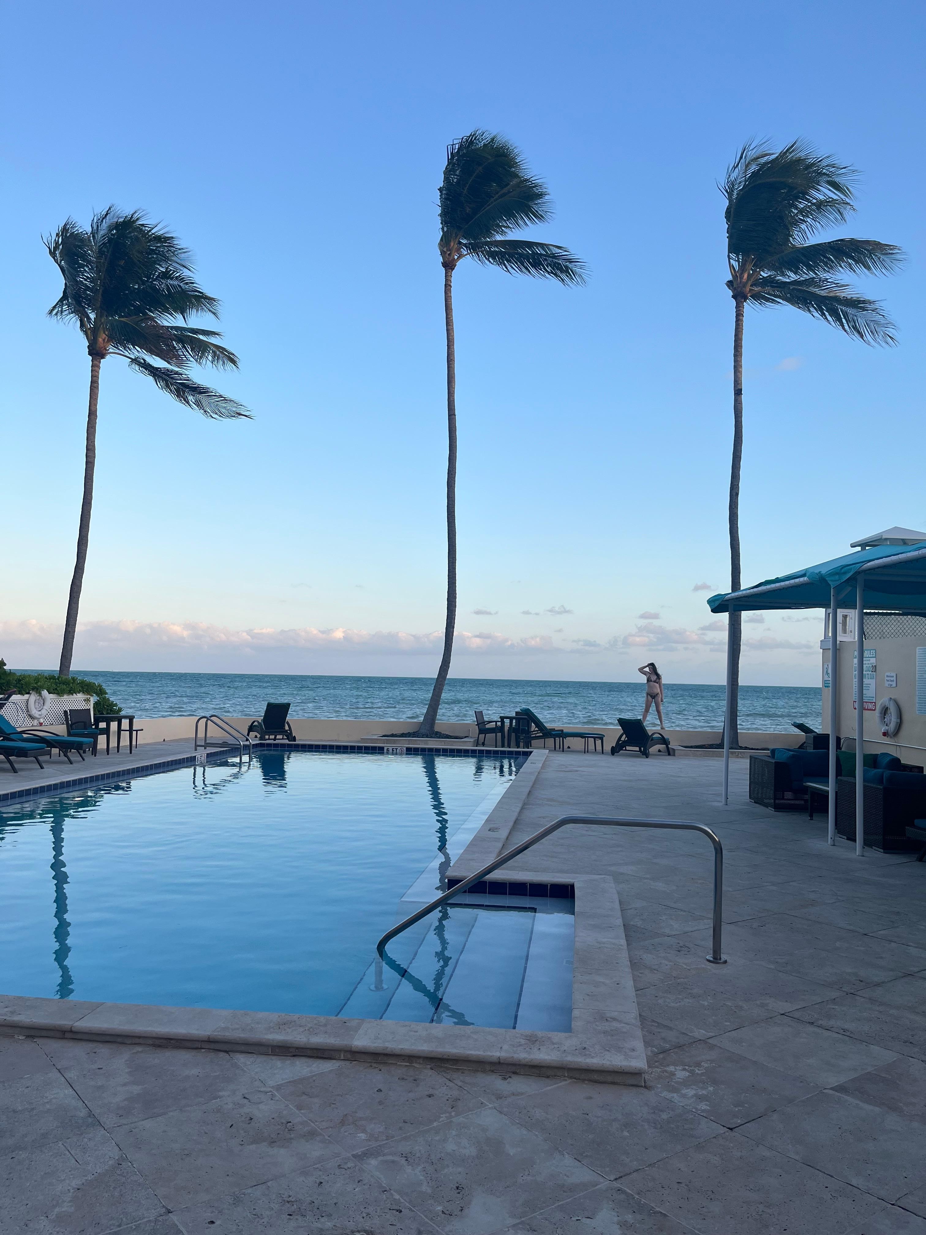 Important - there are 2 pools. The one to the right of the water has a full shade sitting area and an outdoor kitchen area.
