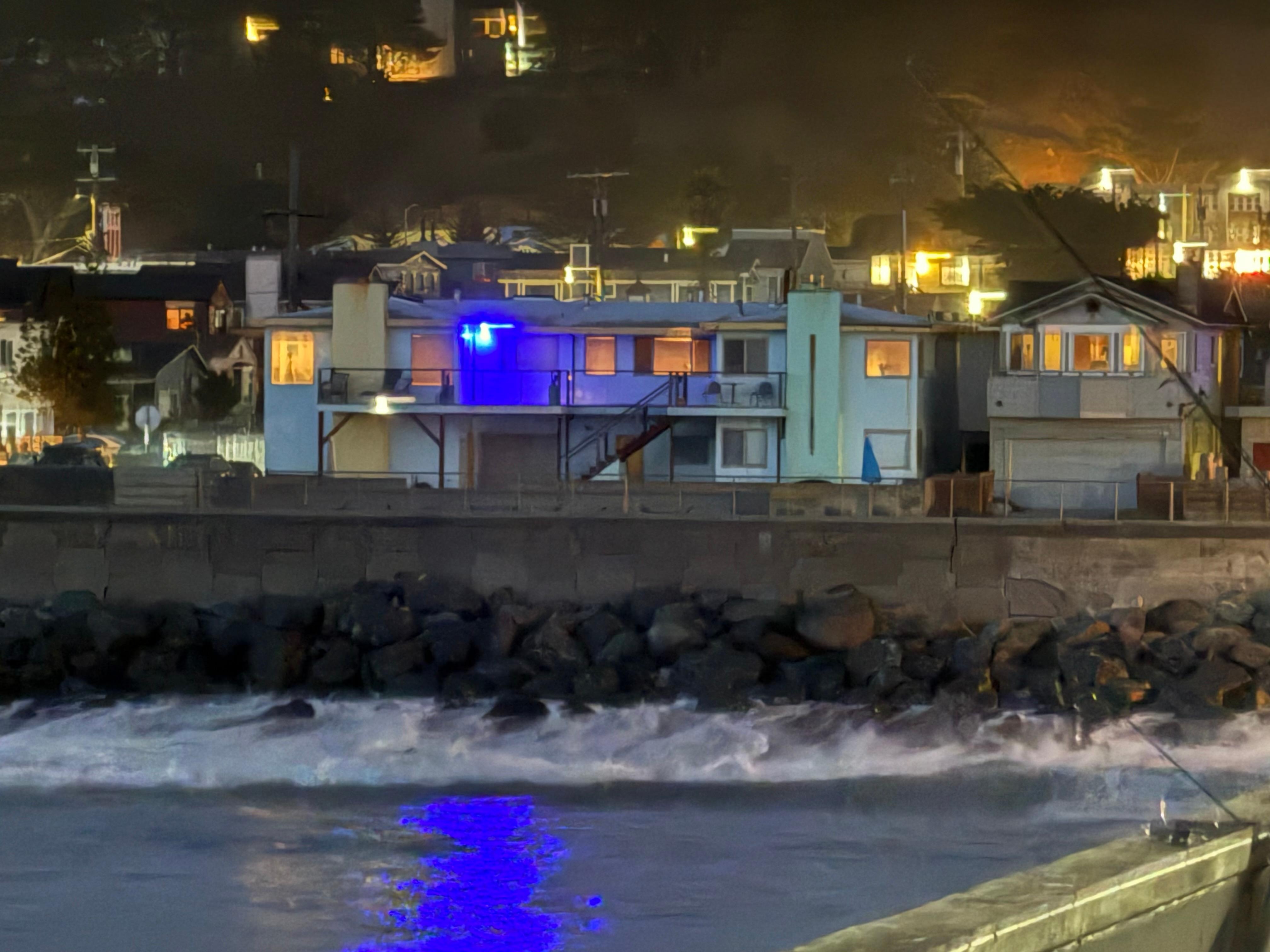 View of the house from the pier at night.