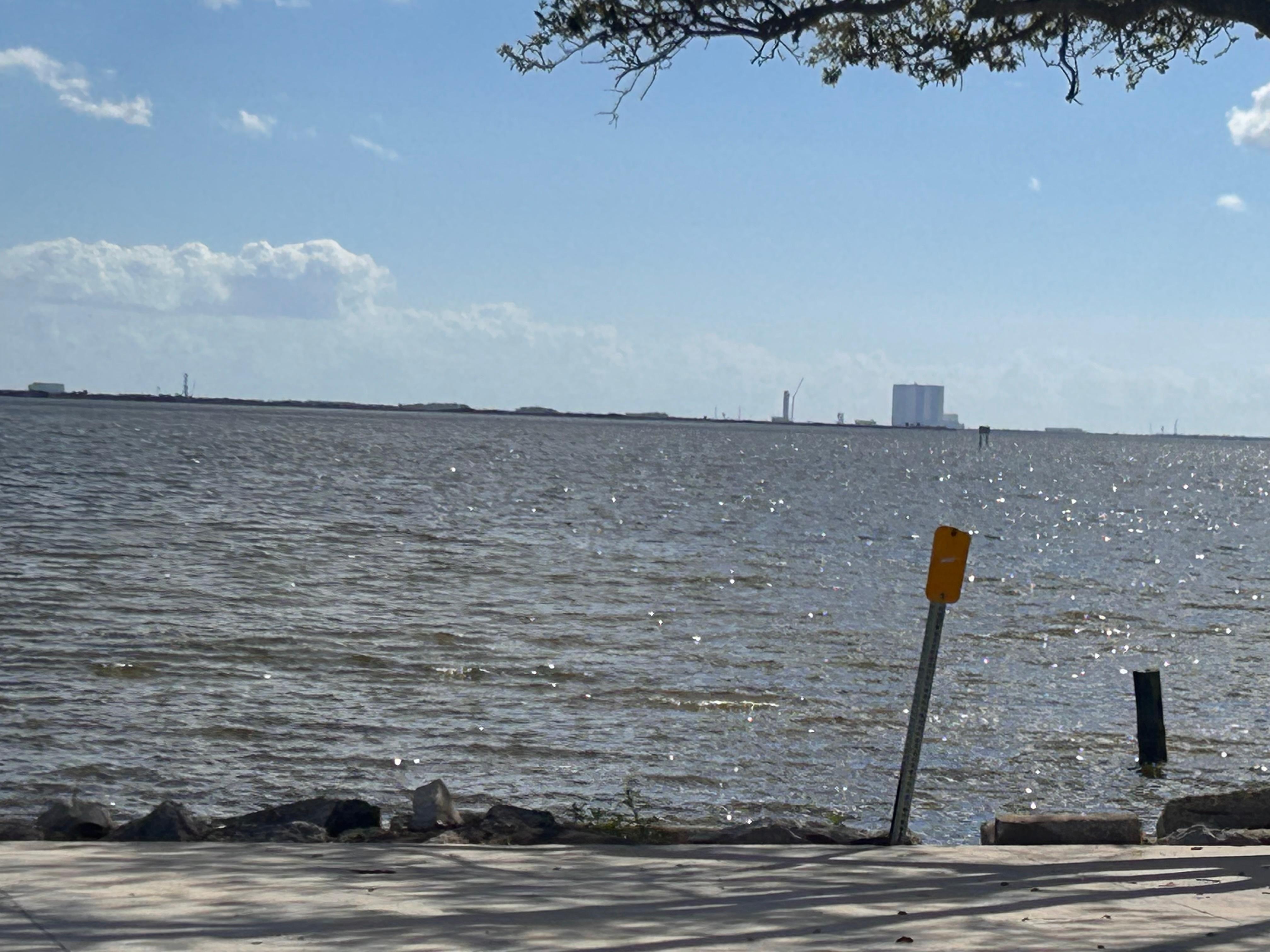 View of the ocean and the VAB at Kennedy Space Center. 