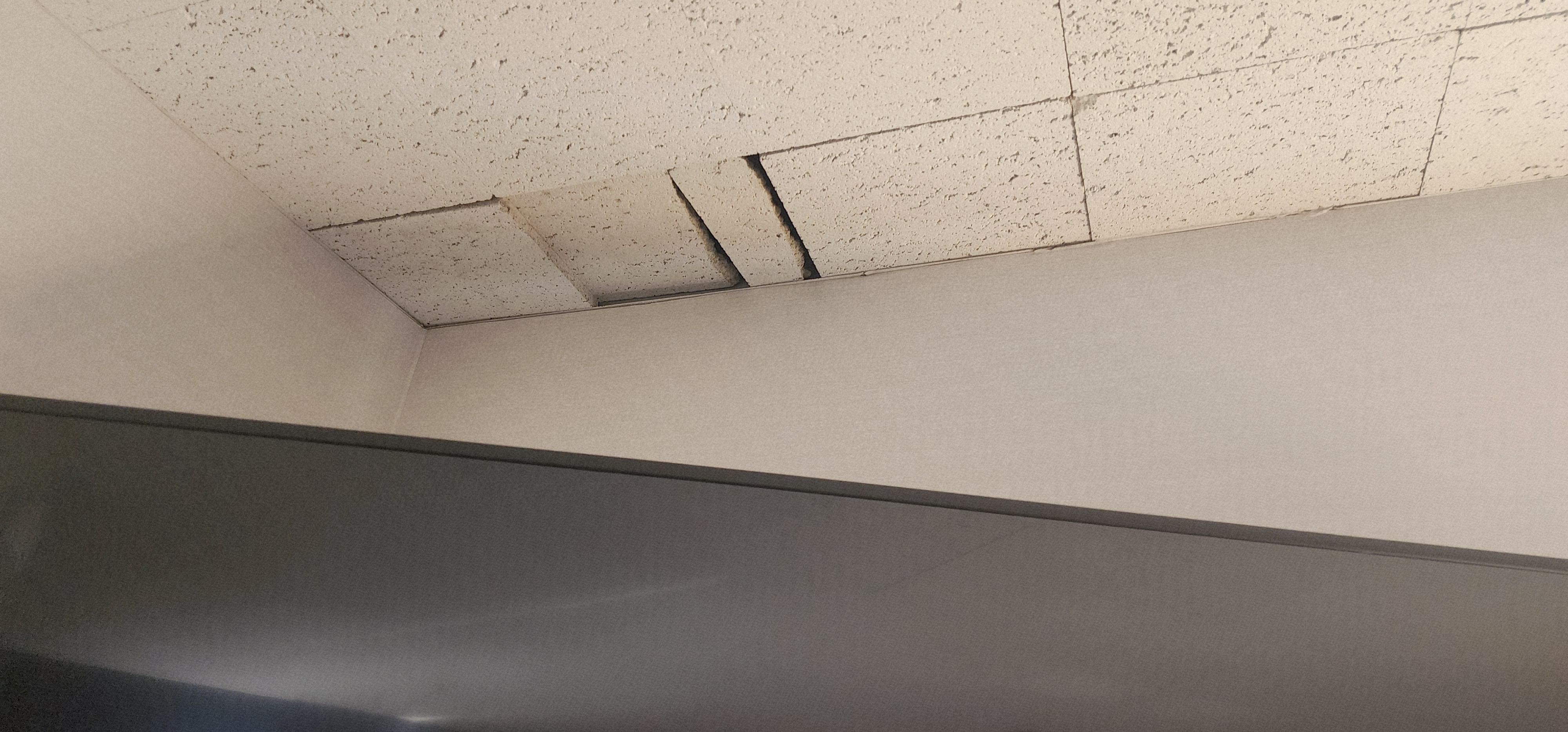 Ceiling tiles open near by TV.  The front desk was very quick to give us a better room.