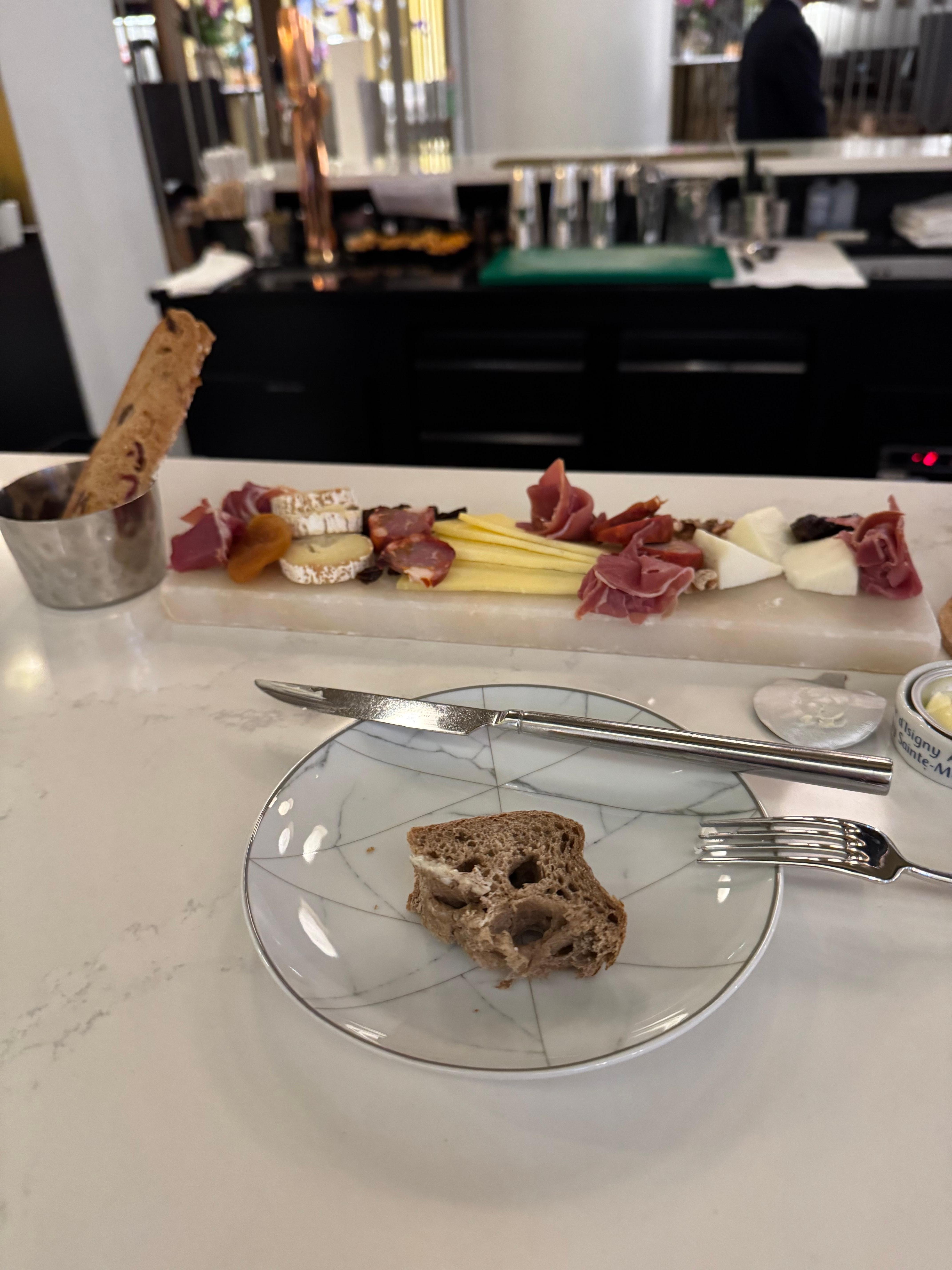 Cheese and meats with a great glass of wine at bar.