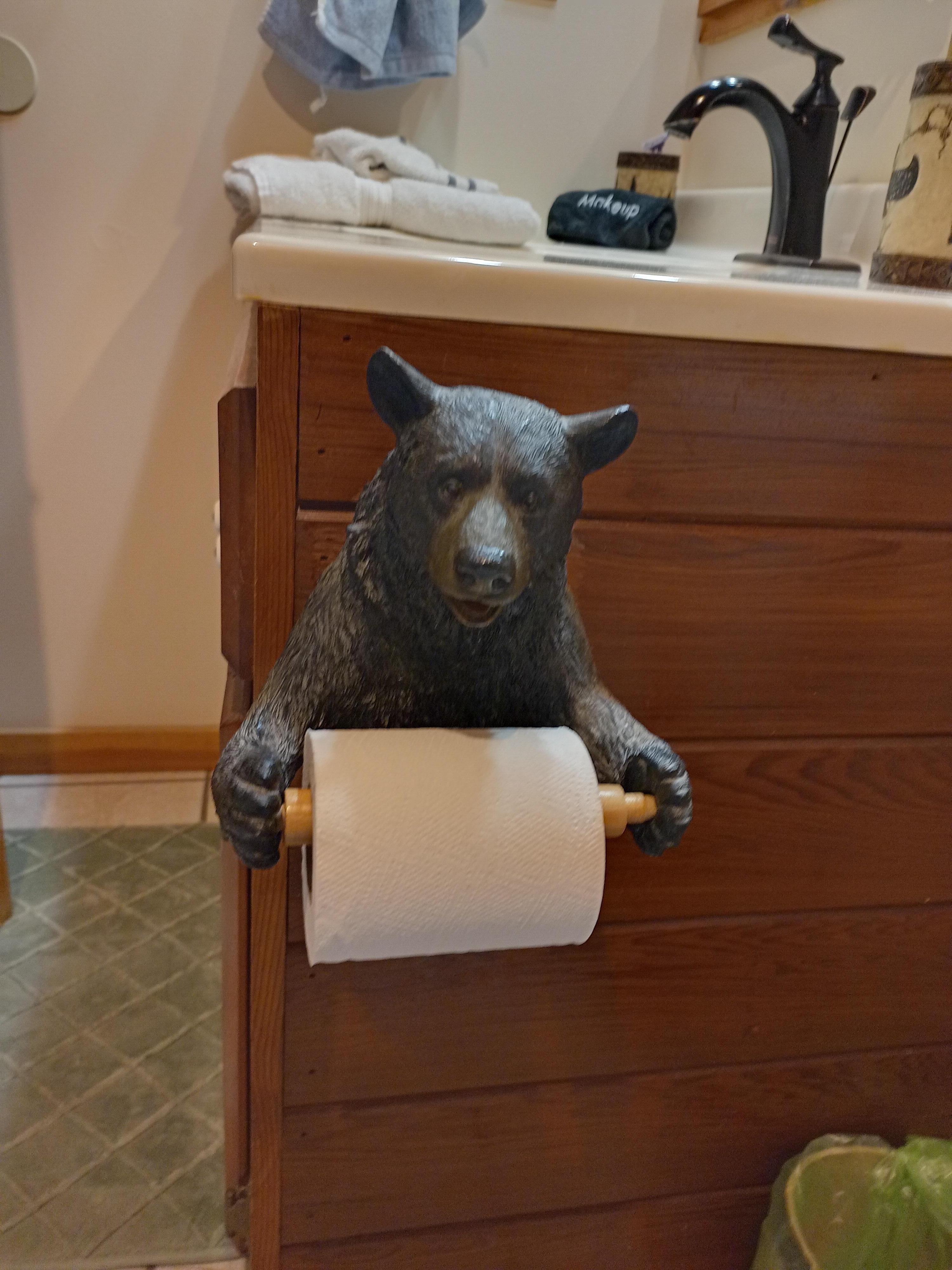 Adorable bear toilet paper holder in the hall bath