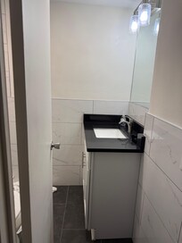 Look at the space between door, vanity and toilet!! Cannot be code
