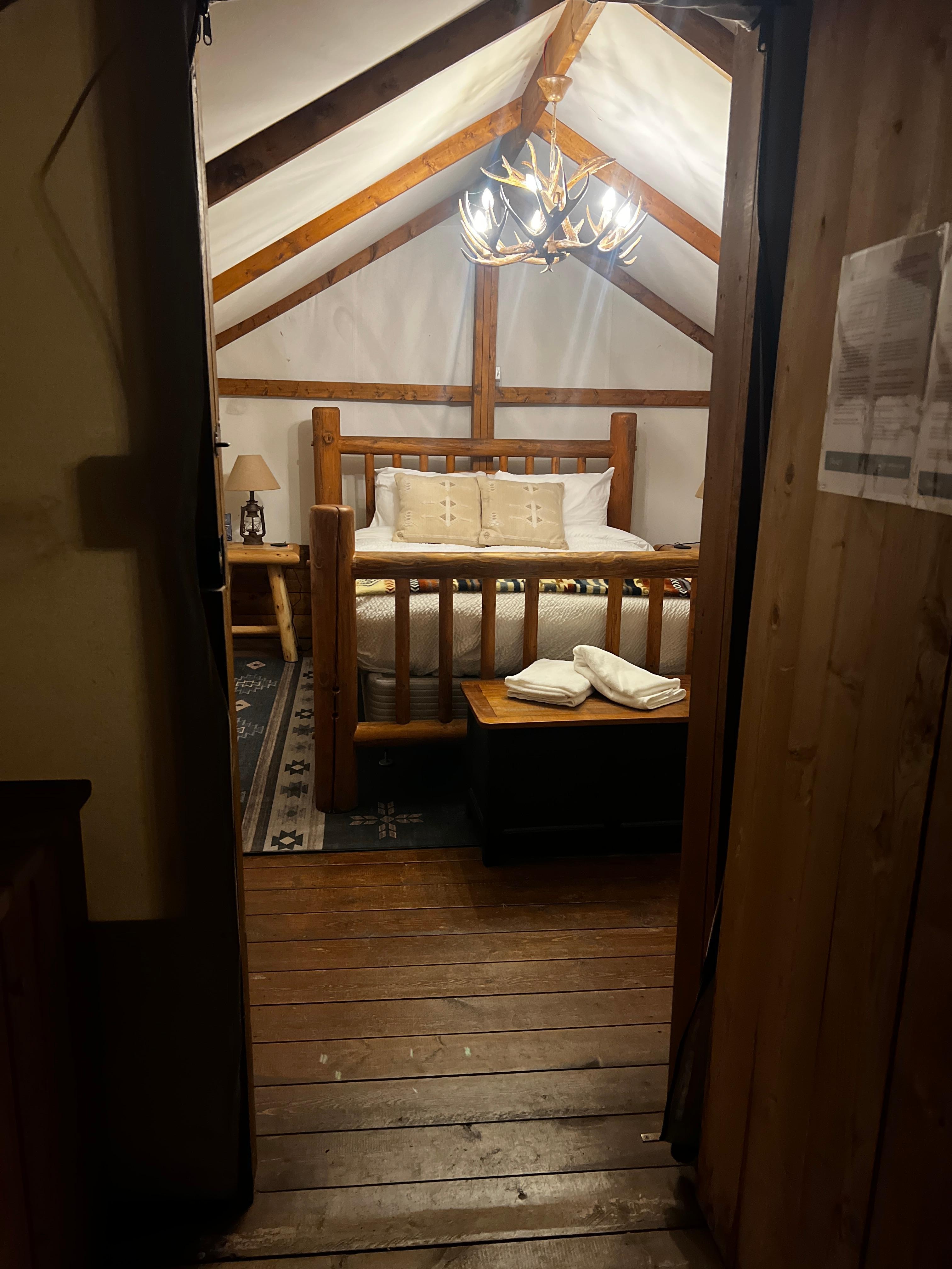 The interior, from outside the door. Out of frame to the right is the kerosene heater and a second side table. 