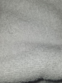 Human or dog hair on 'folded clean towel'